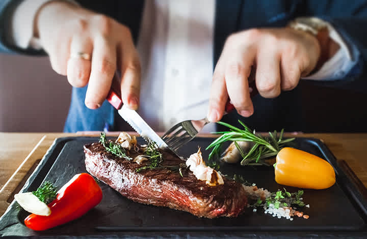 Man cutting steak set