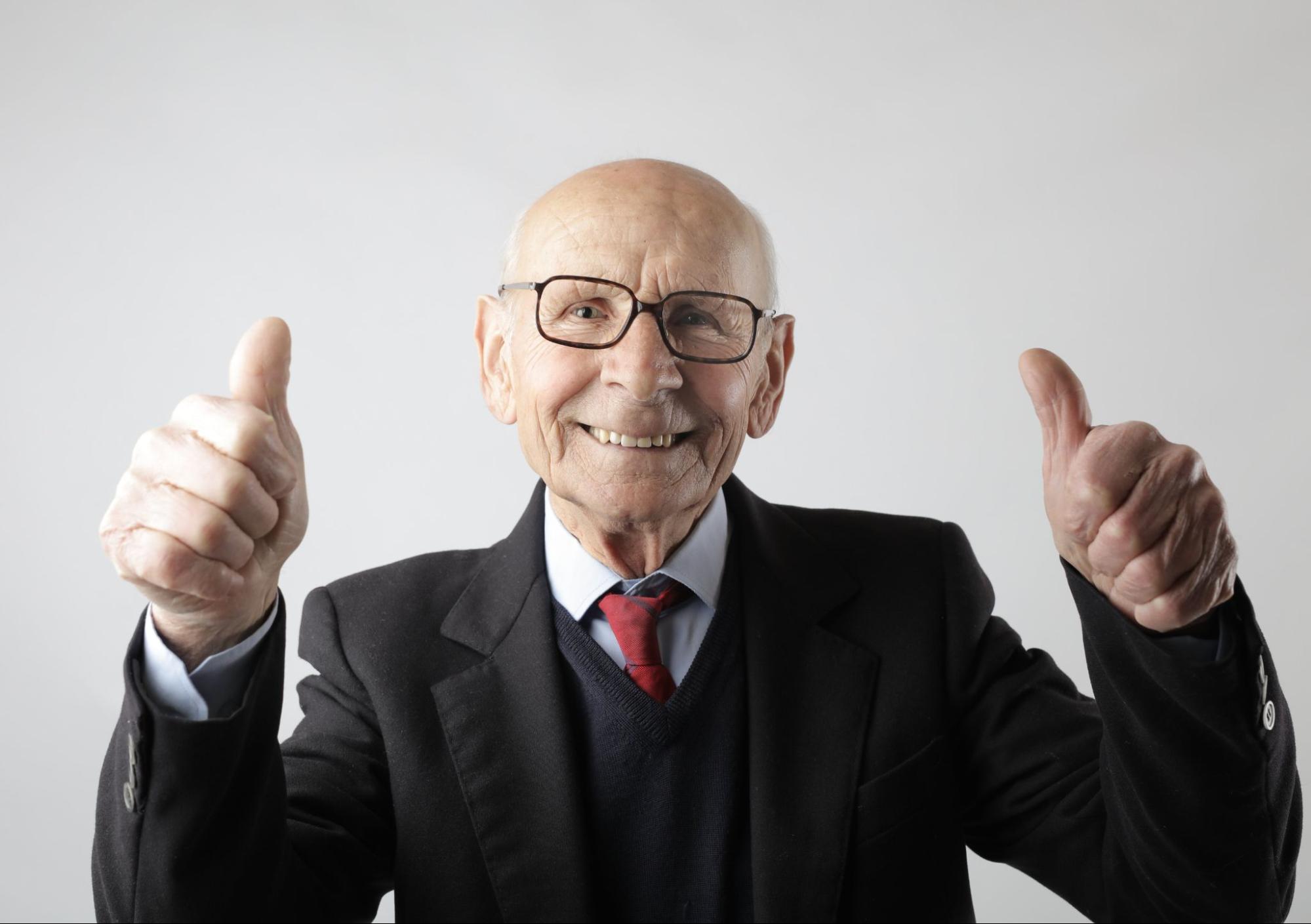 Older man giving thumbs up