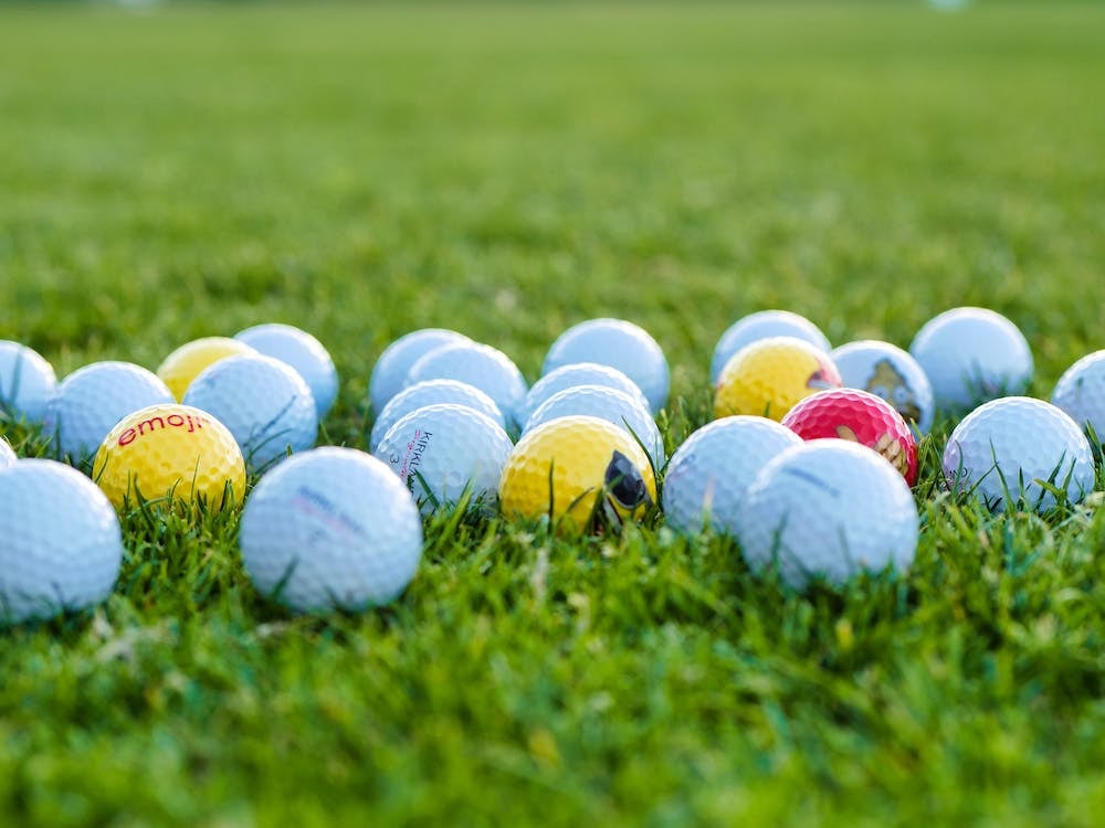 Golf balls in grass