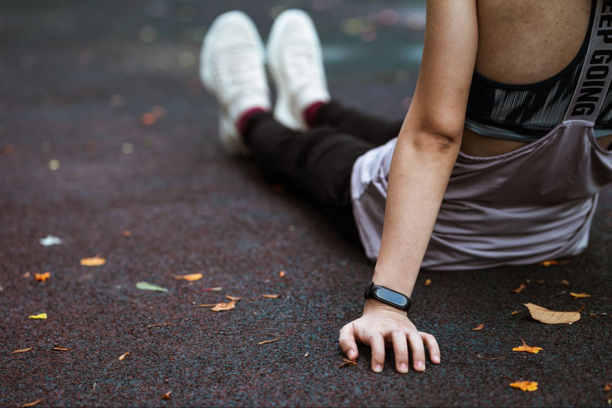 Person in workout gear wearing a fitness tracker