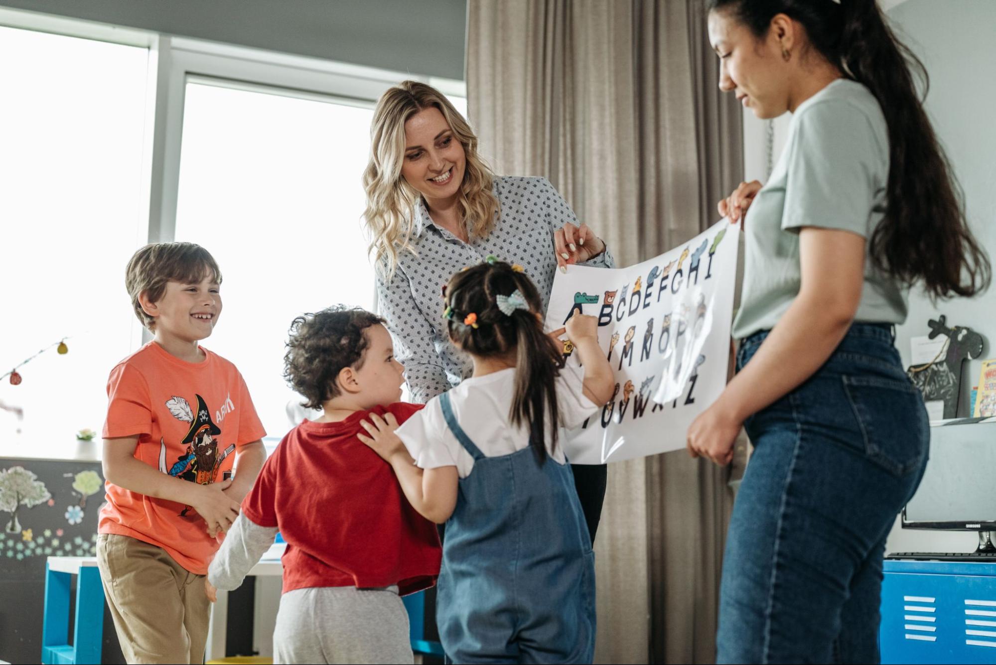 Teacher working in the classroom with children