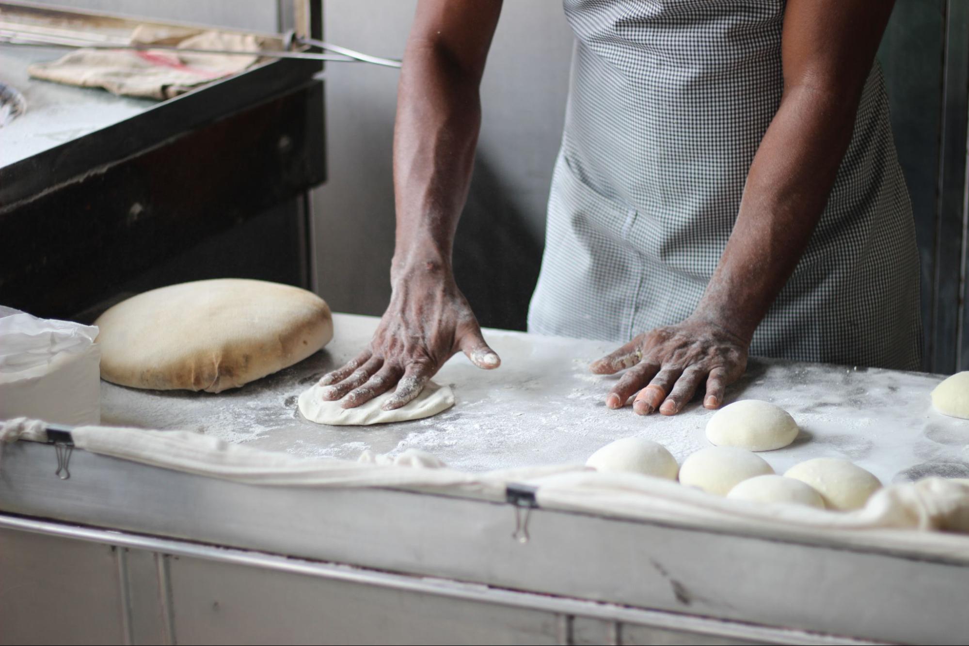 Person making bread in ktichen
