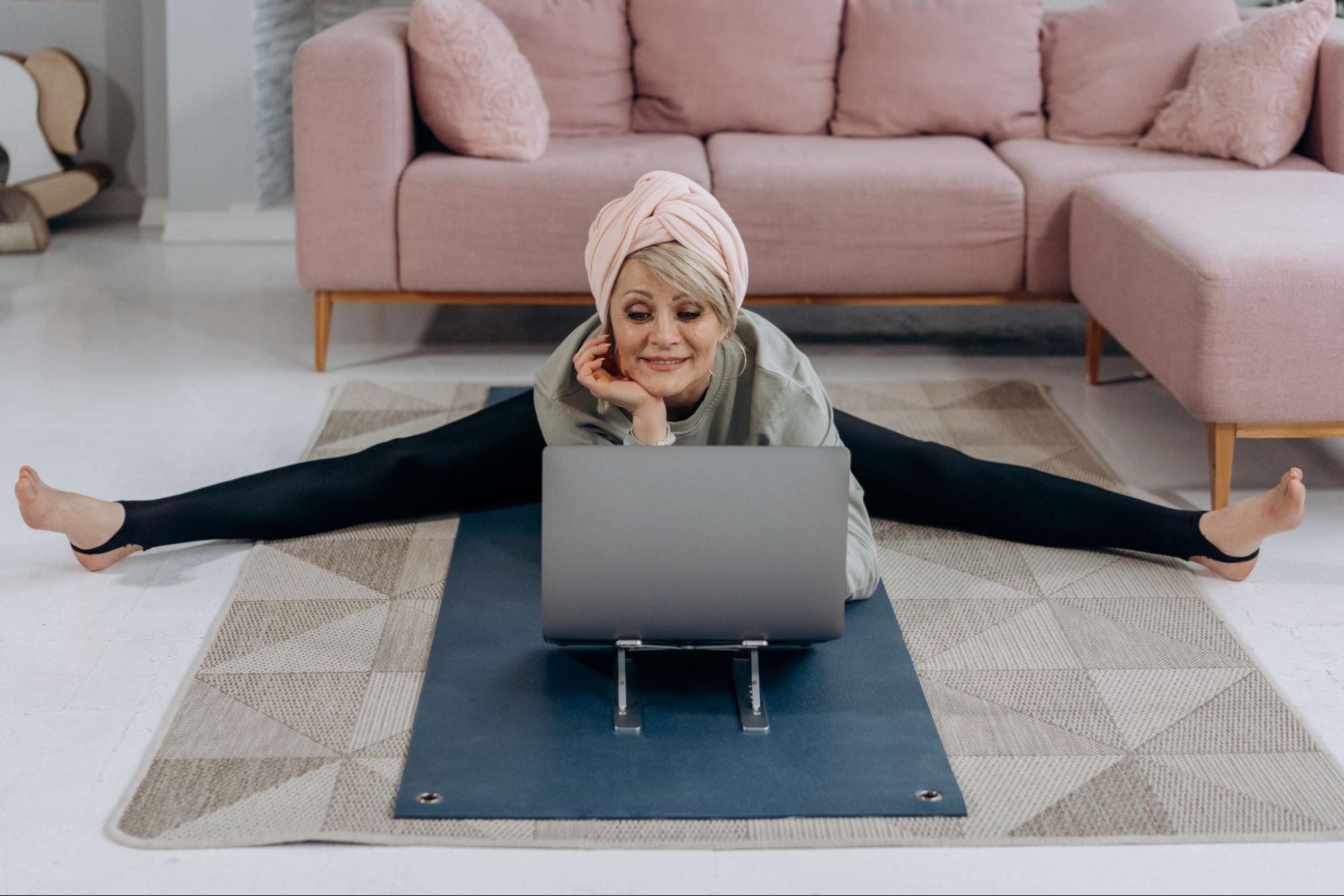 Woman taking yoga class virtually