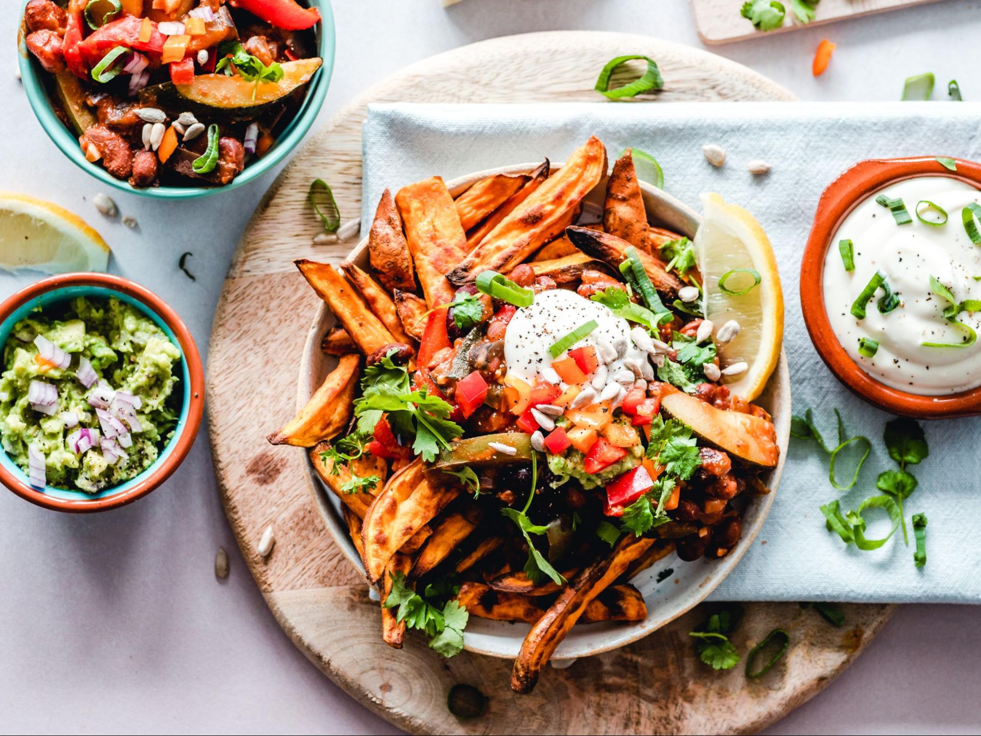 Food in a bowl with various sauces