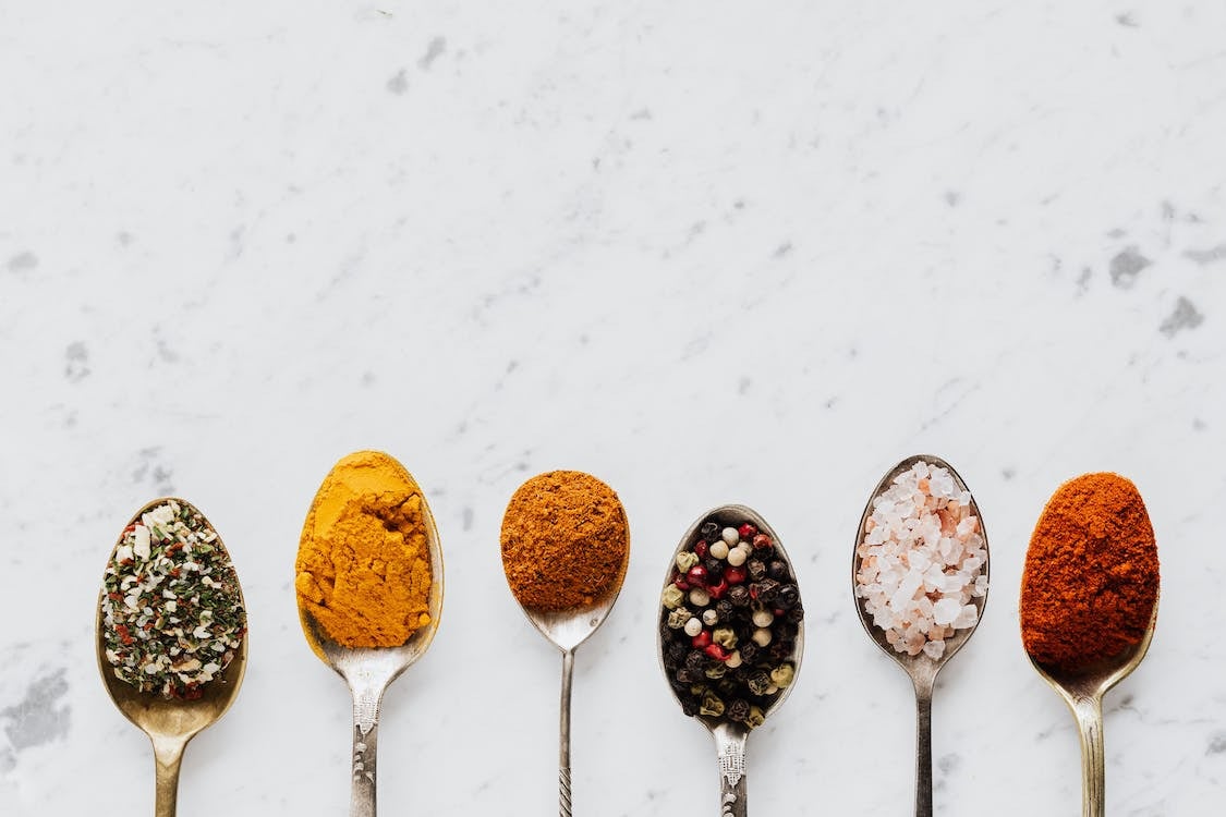 Various spices on spoons