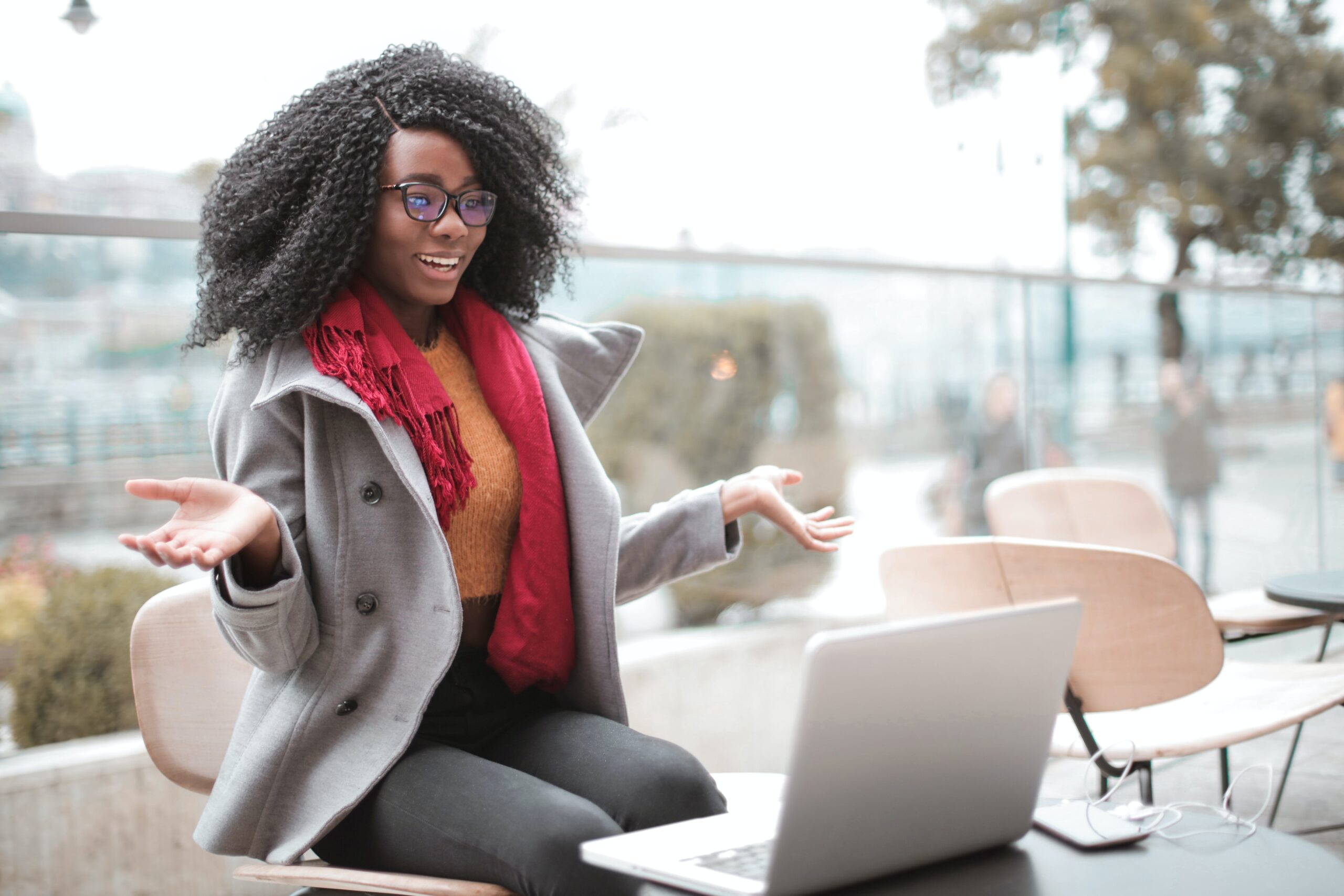 Woman reacting positively to something on computer screen