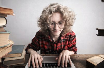 Person typing on laptop and looking intently