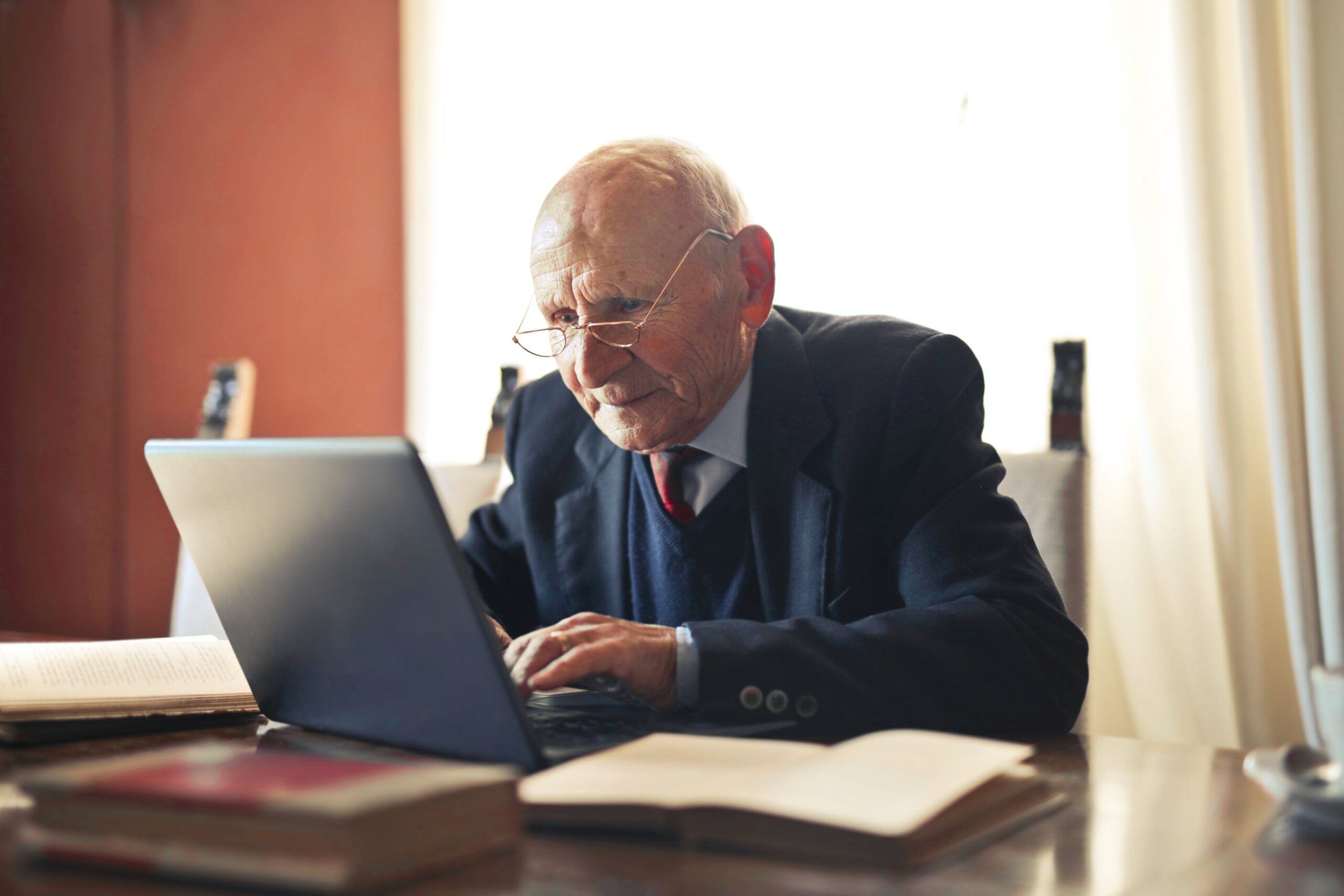 Older man using computer to type