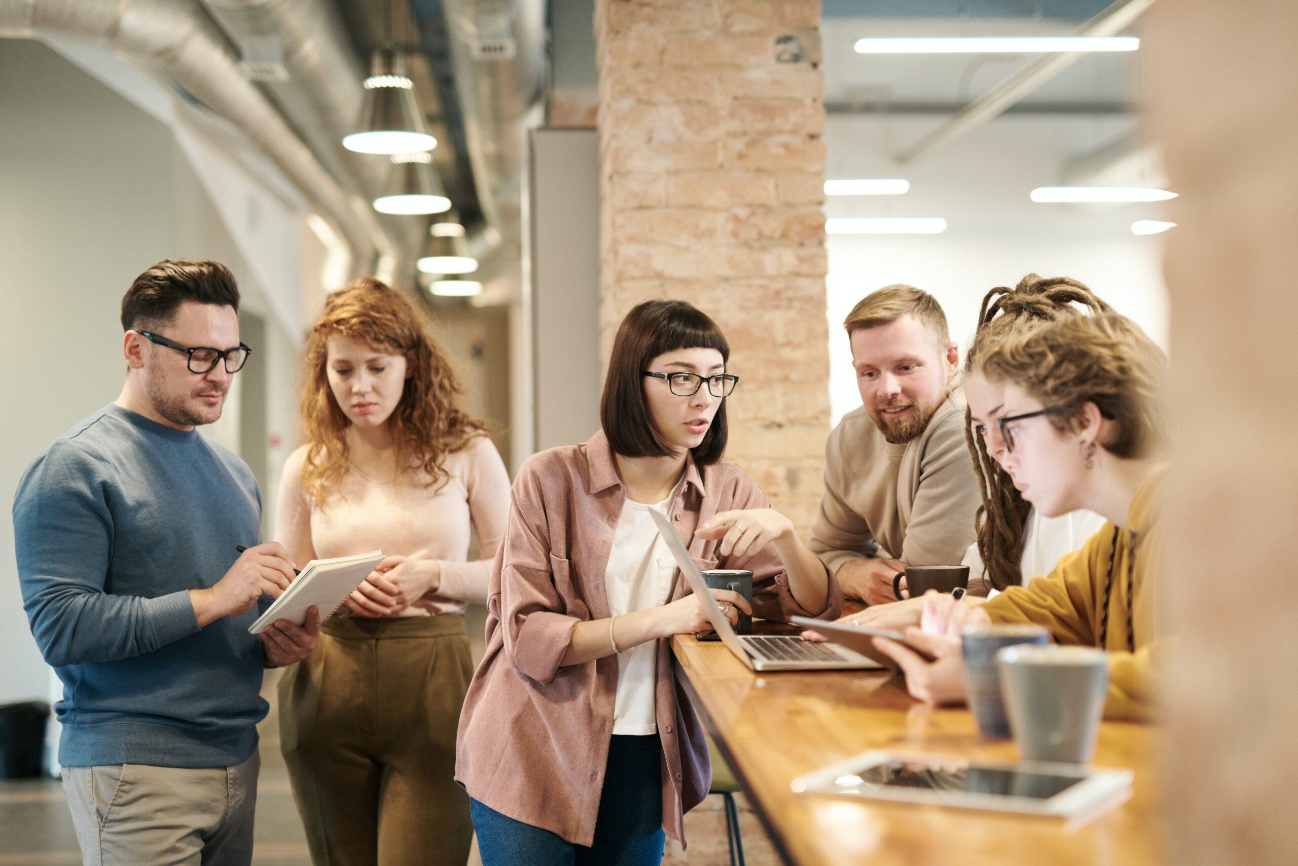 People standing together in office hallway