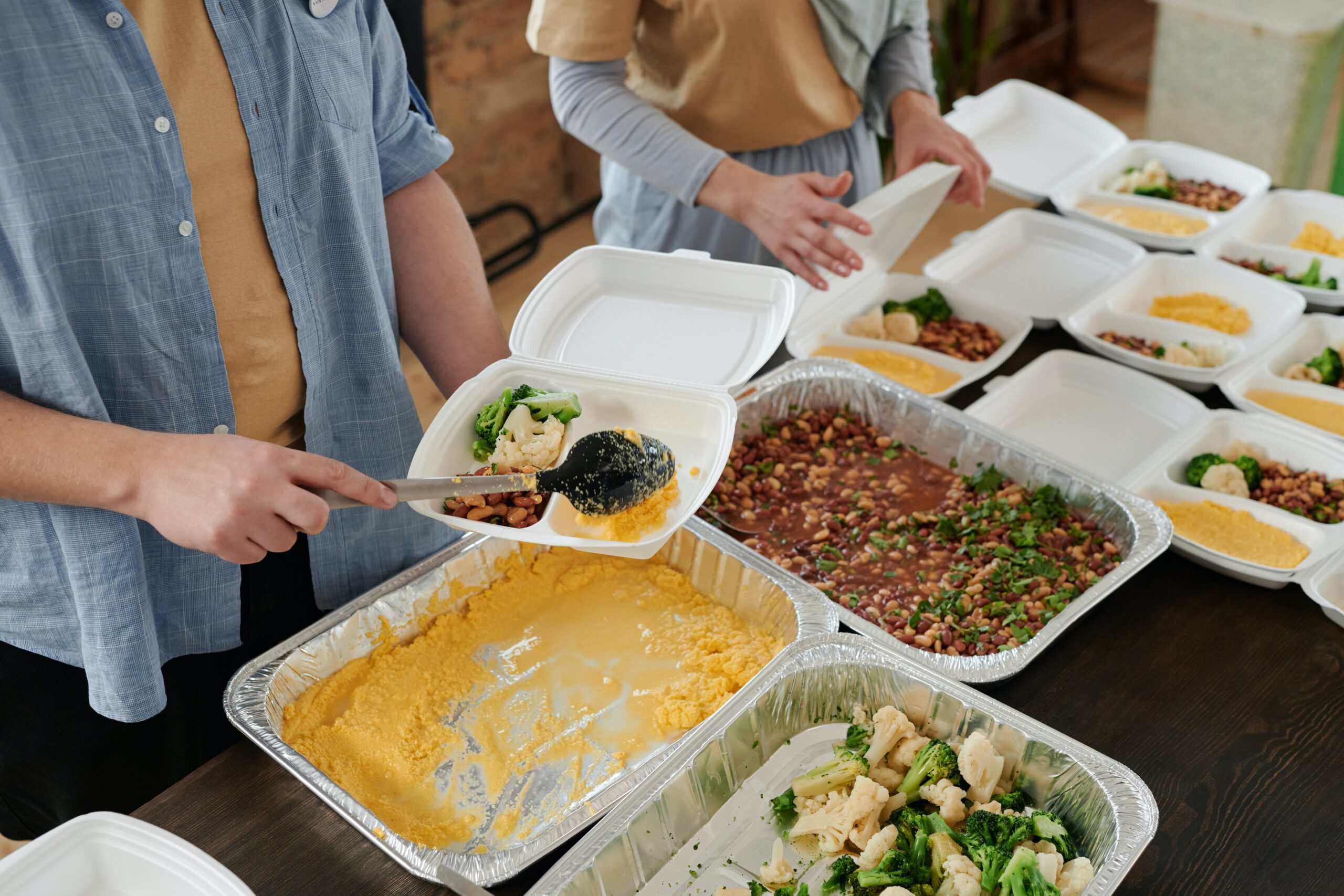 People serving hot meals