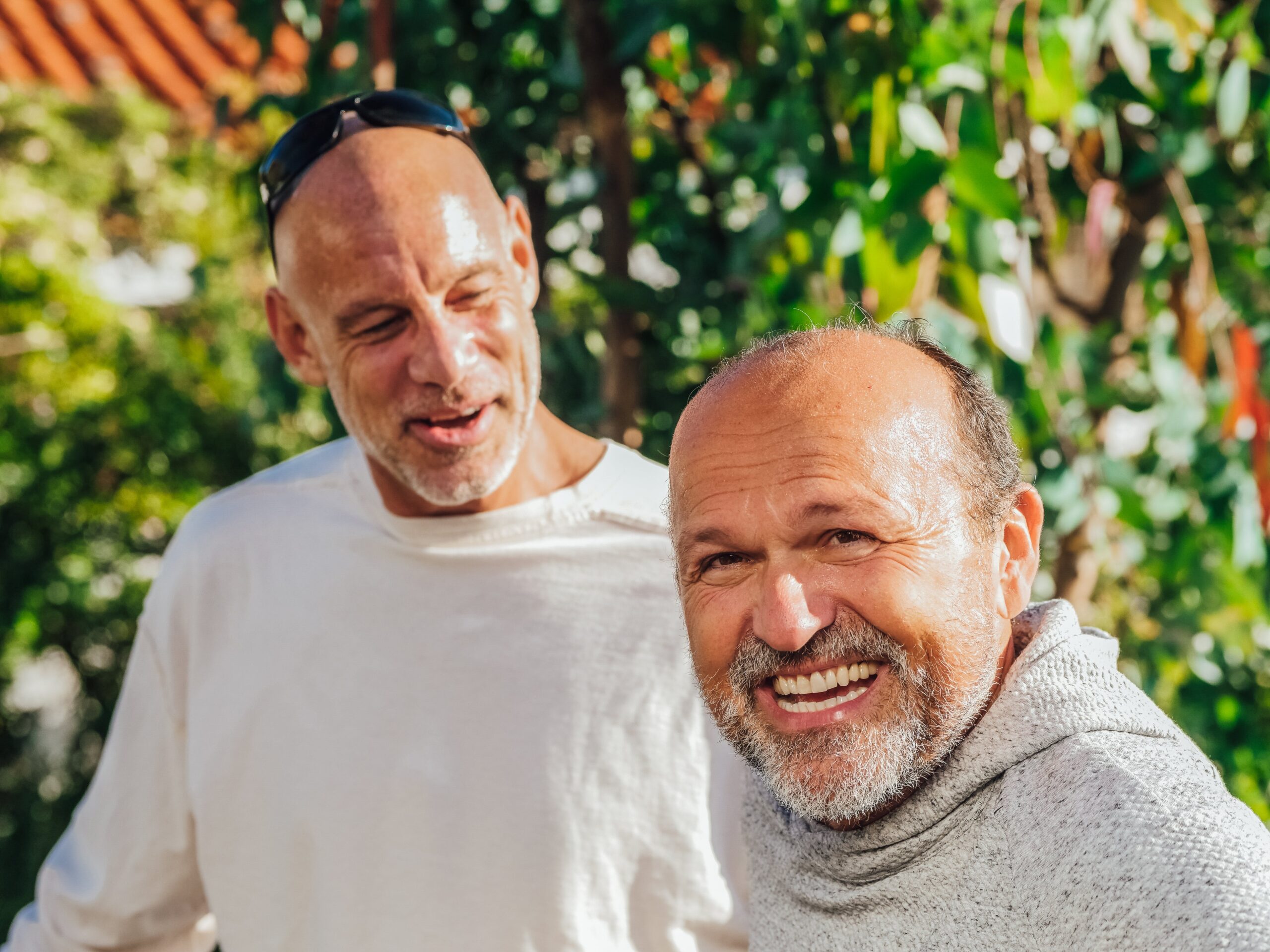 Two older men laughing together
