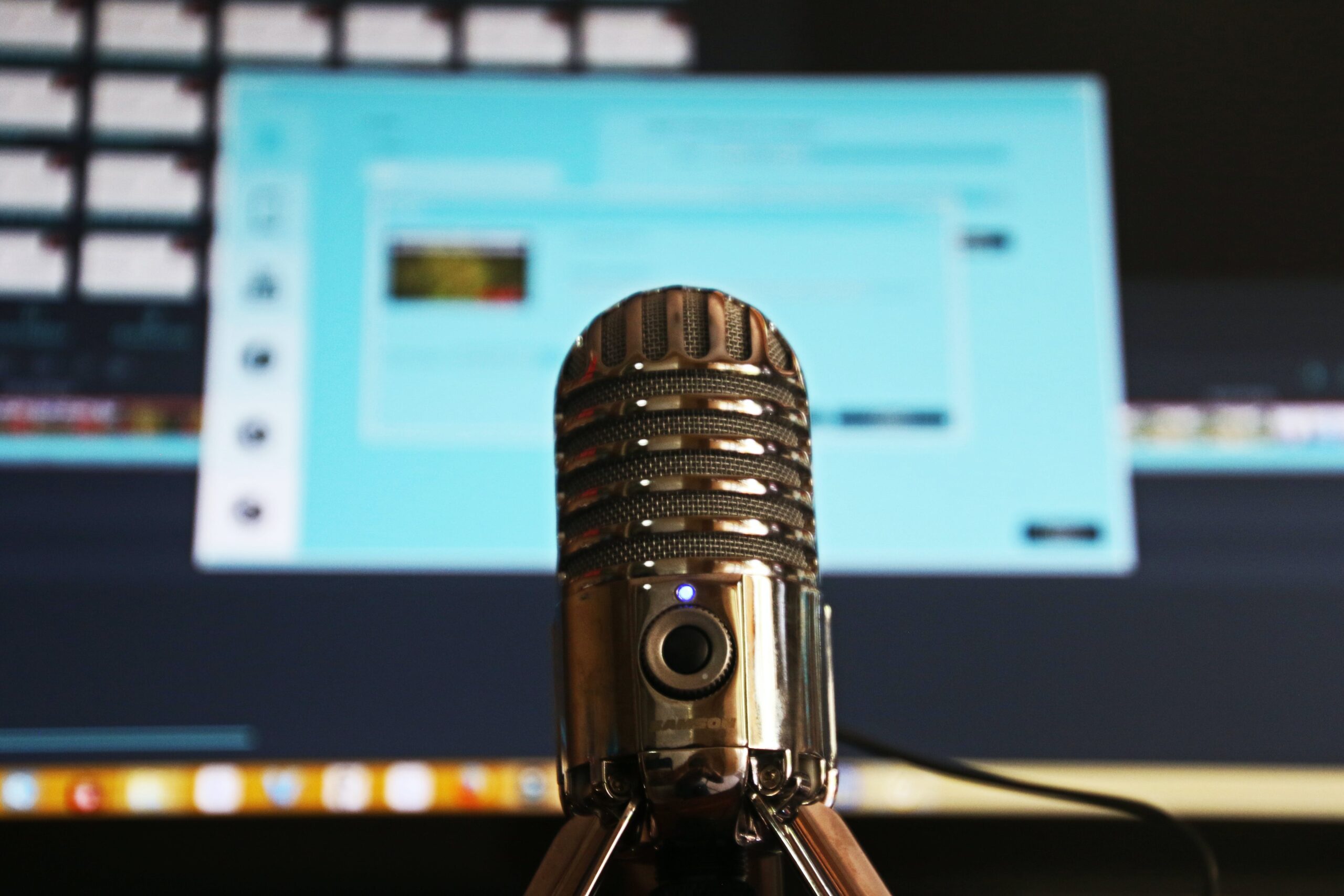 Podcast microphone in front of laptop