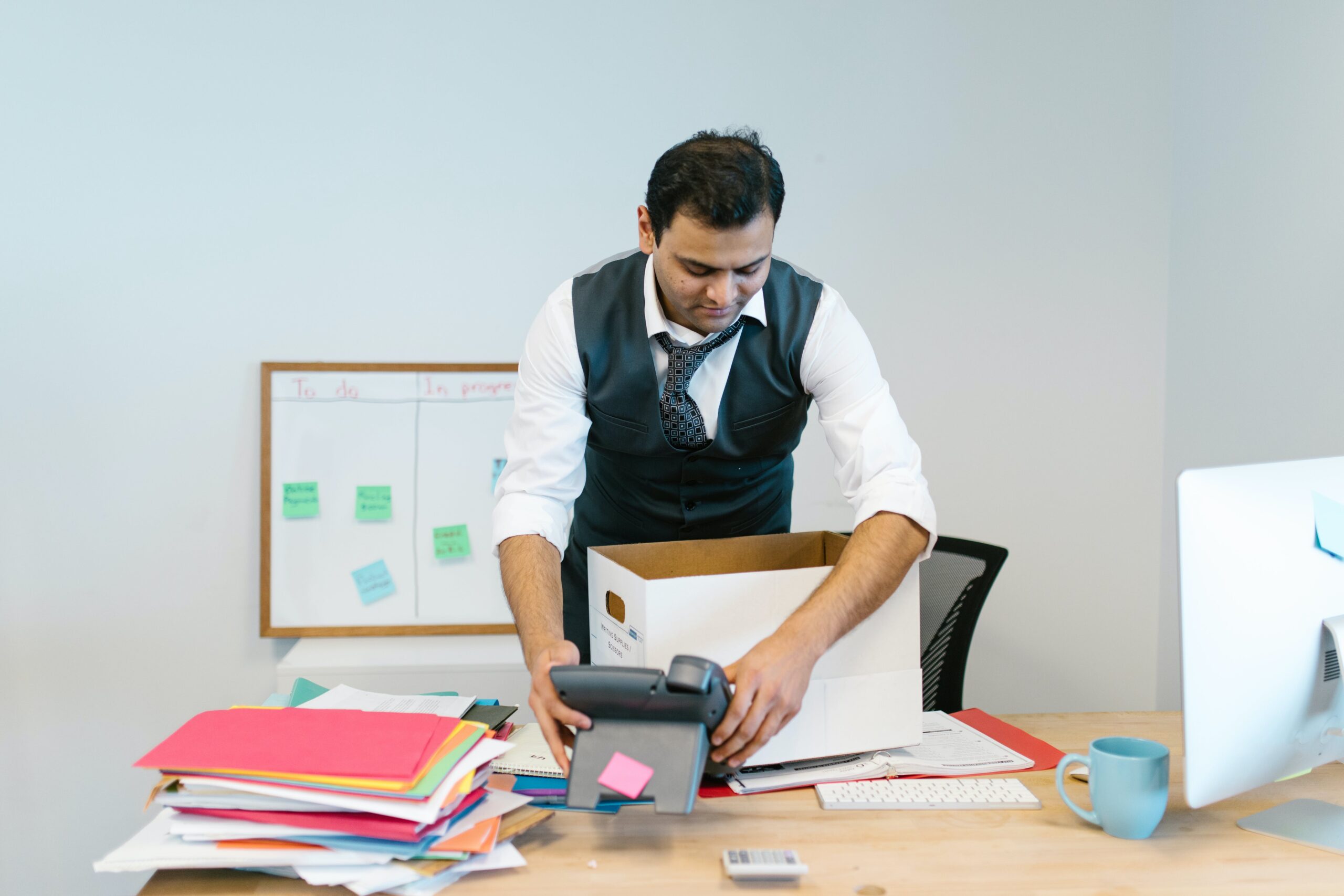 Man packing desk up