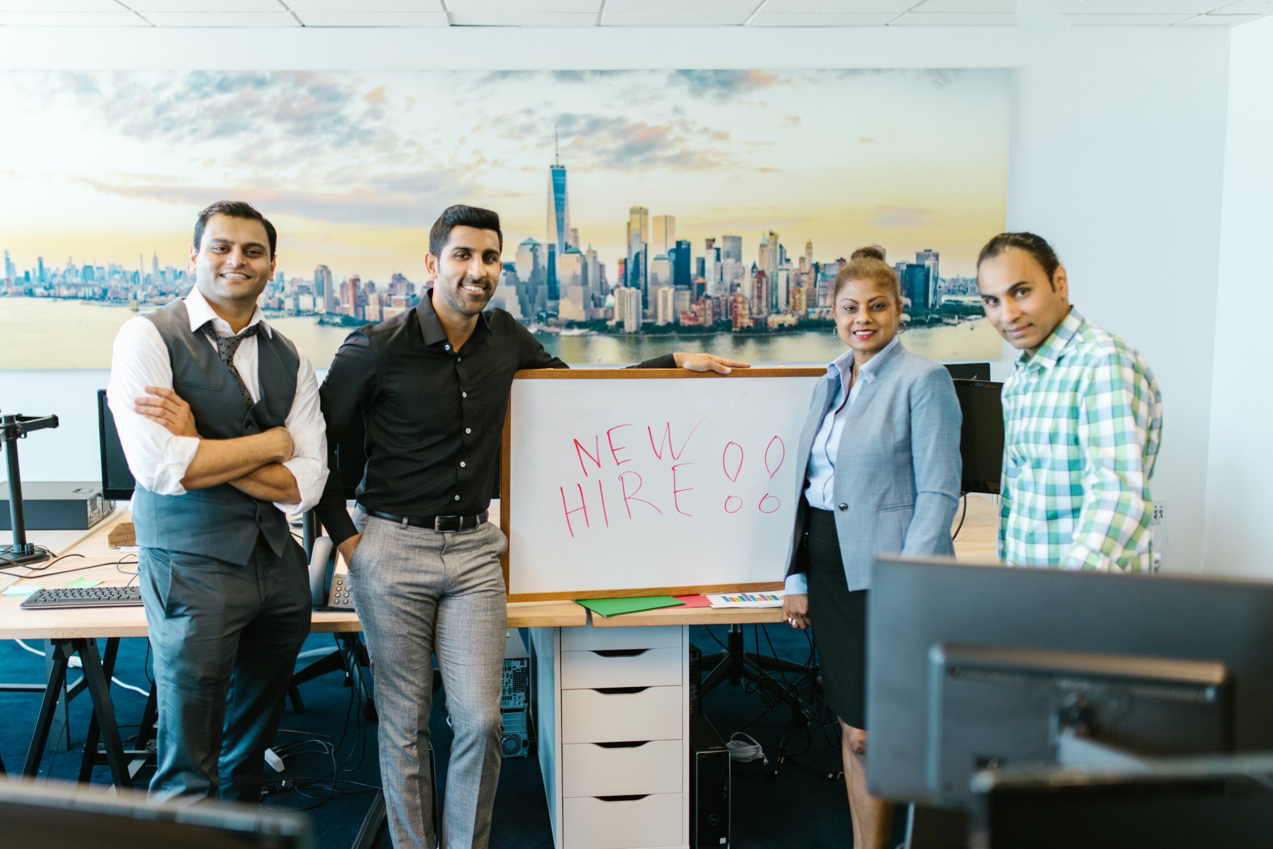 Group of people in office ready to welcome new hire