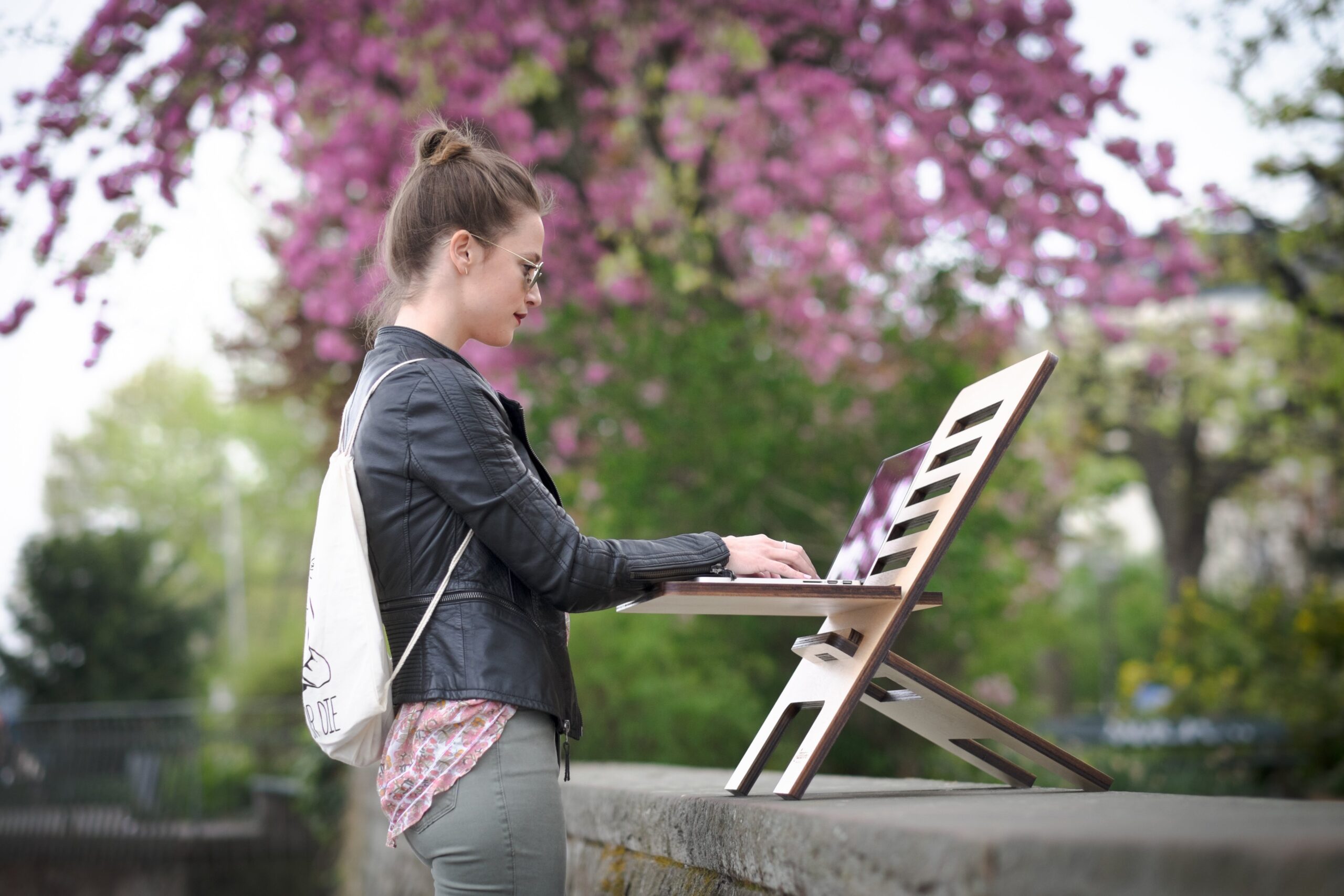 woman working outside on laptop