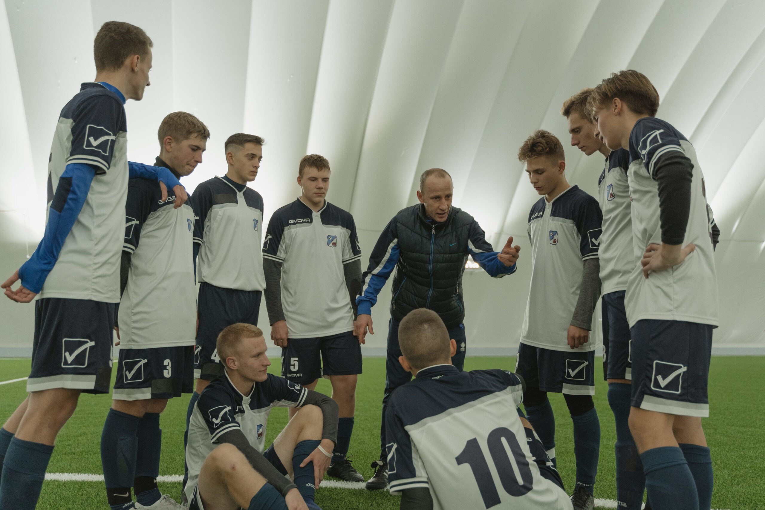 Sports coach working with older athletes