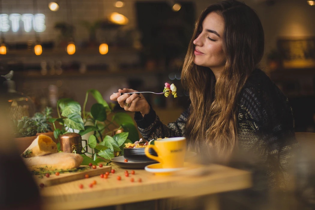 Person eating meal in restaurant