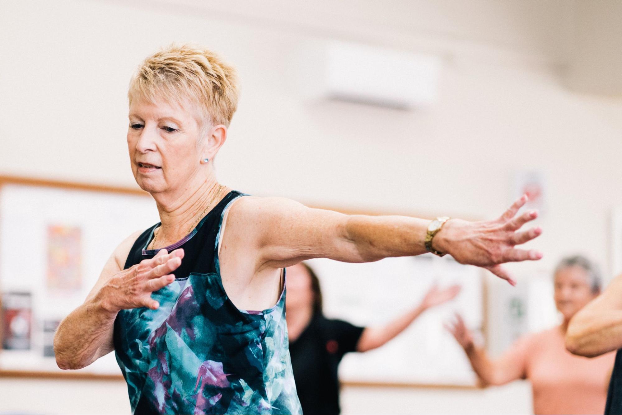 Retiree dancing in class