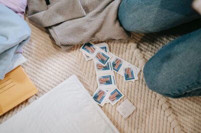 Postage stamps on floor with envelope