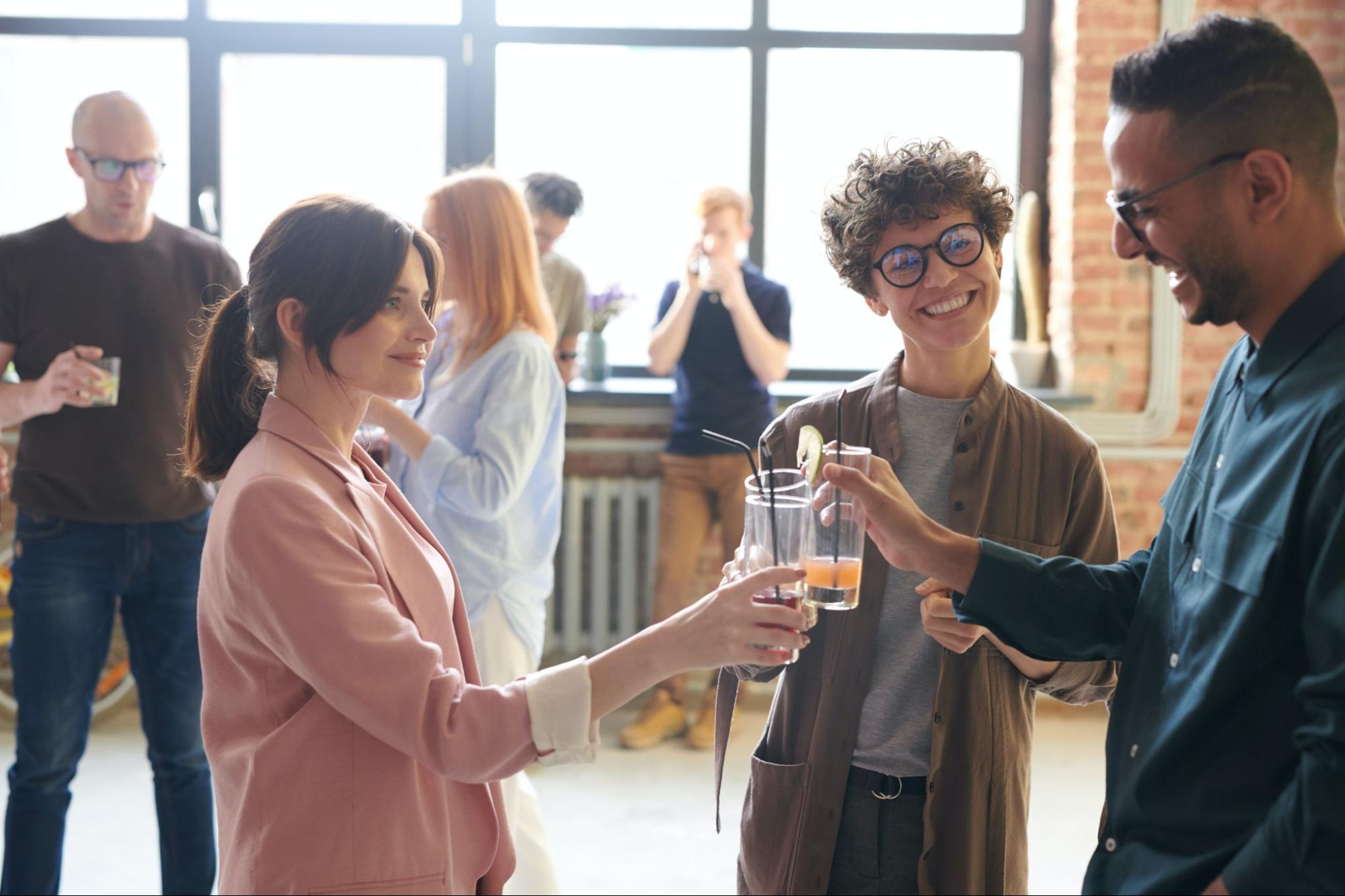 Employees and families celebrating together with drinks