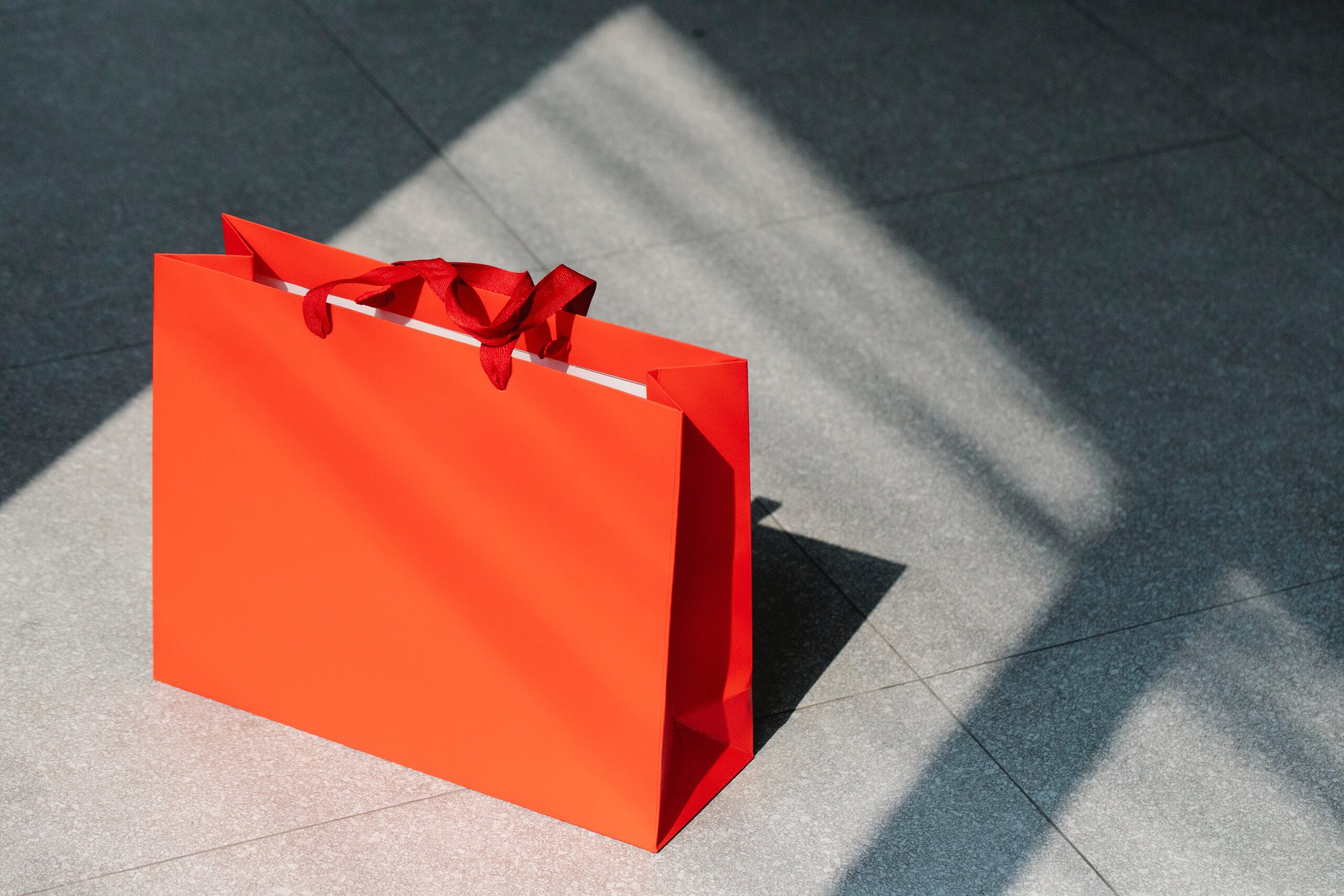 Red gift bag sitting on ground