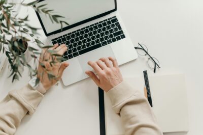 Person using laptop to send eCard via email