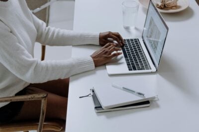 Person typing on laptop