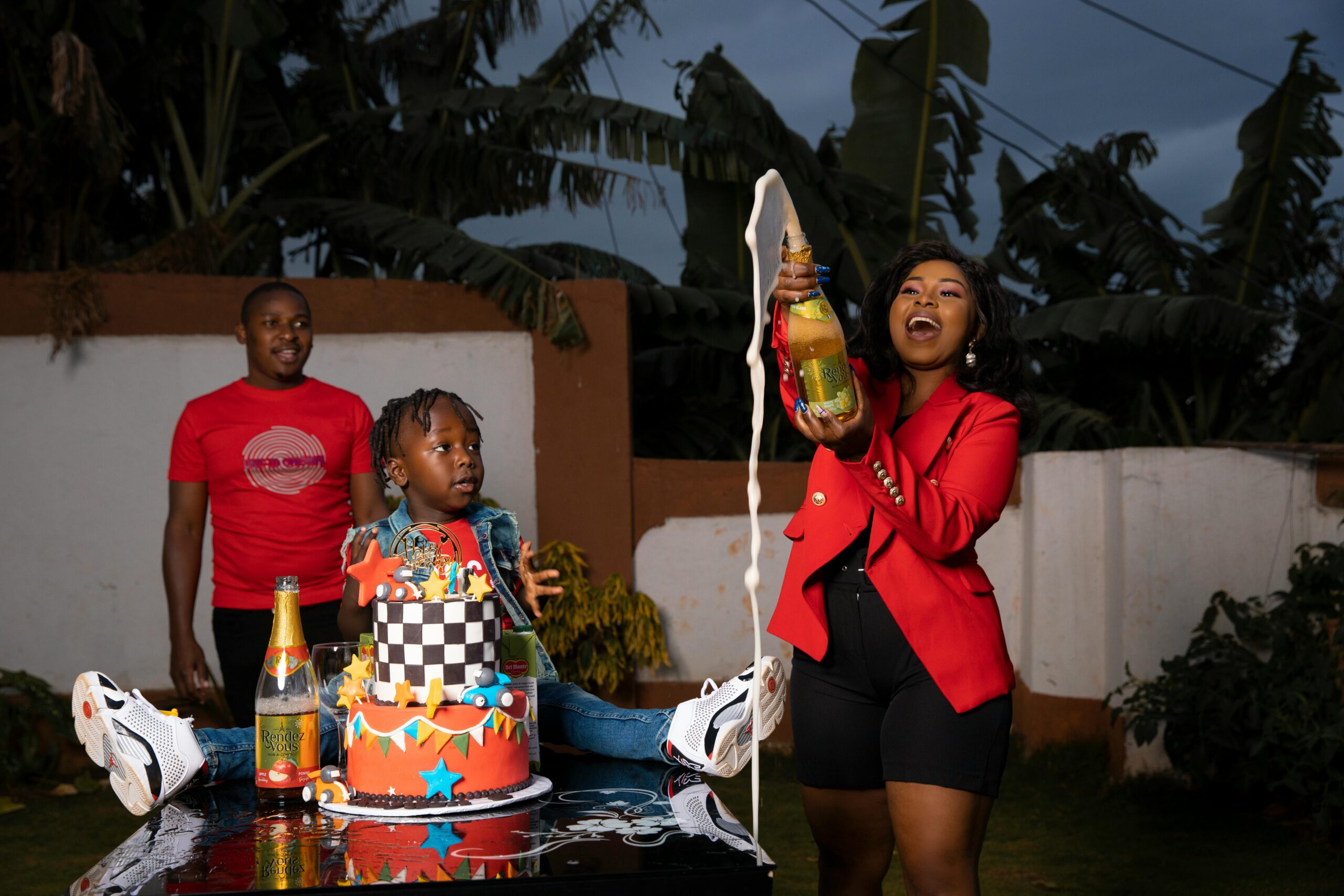 Mom celebrating birthday by popping champagne