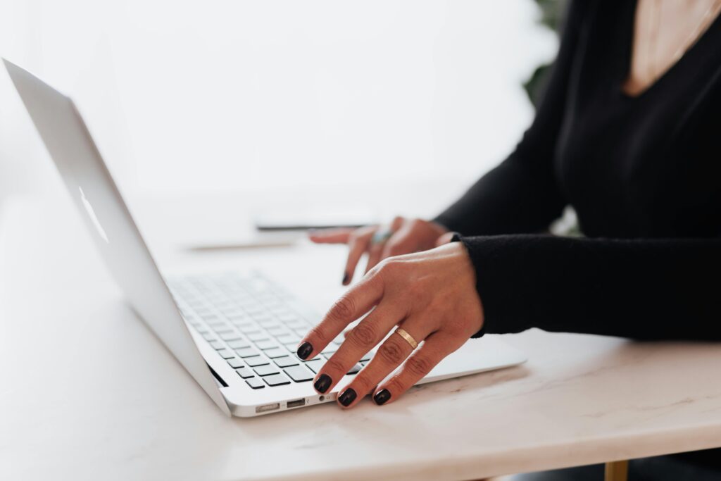 Person working on laptop at desk