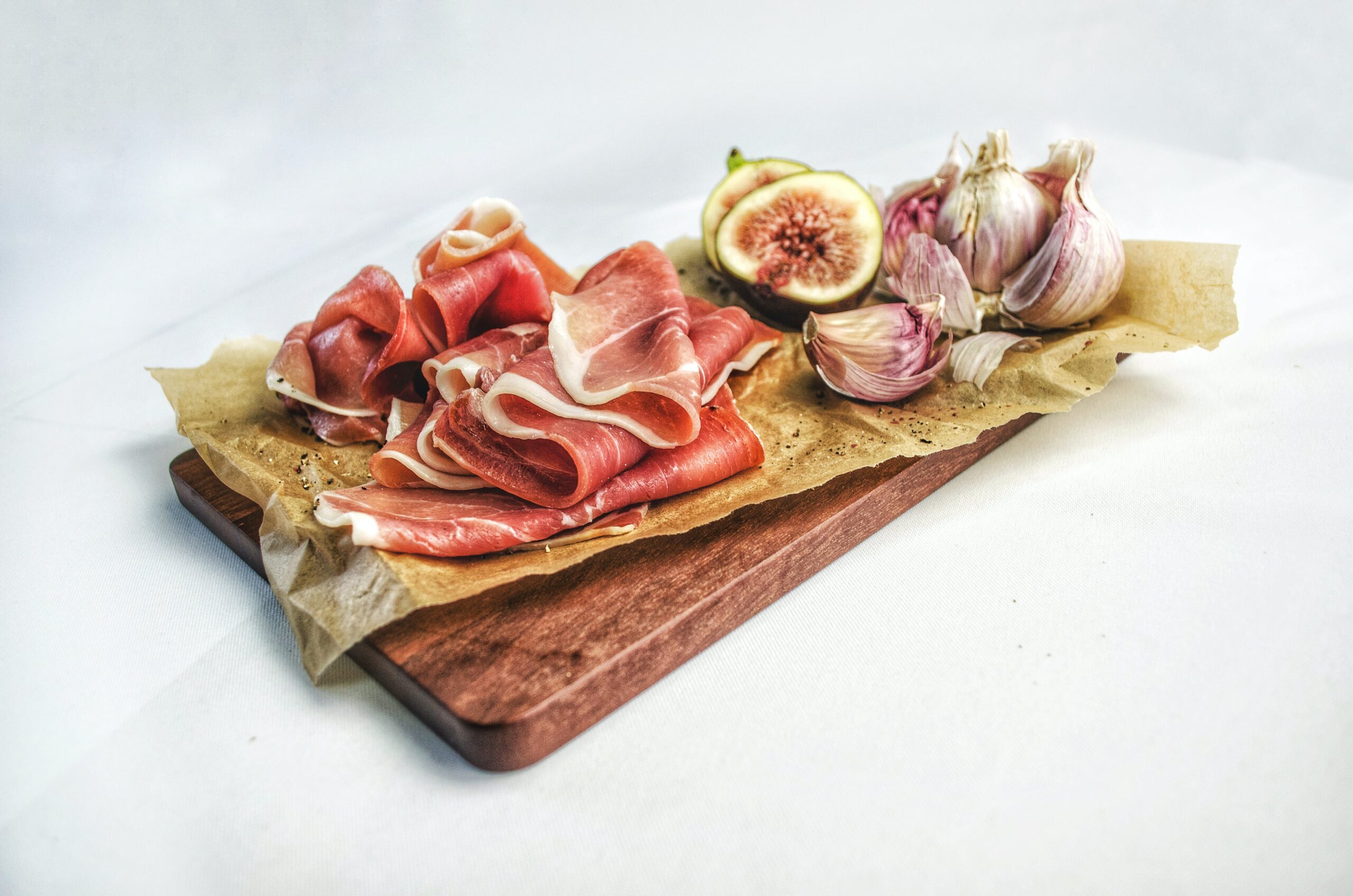 Charcuterie board with meat and fig