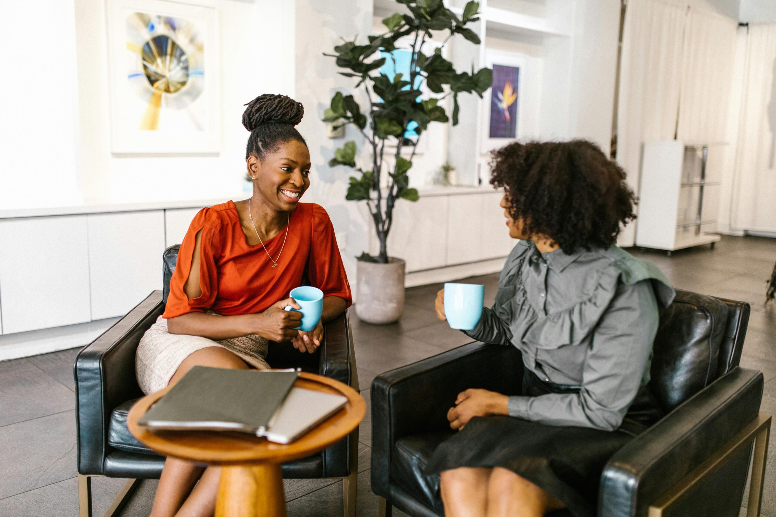 Employee having coffee with mentor