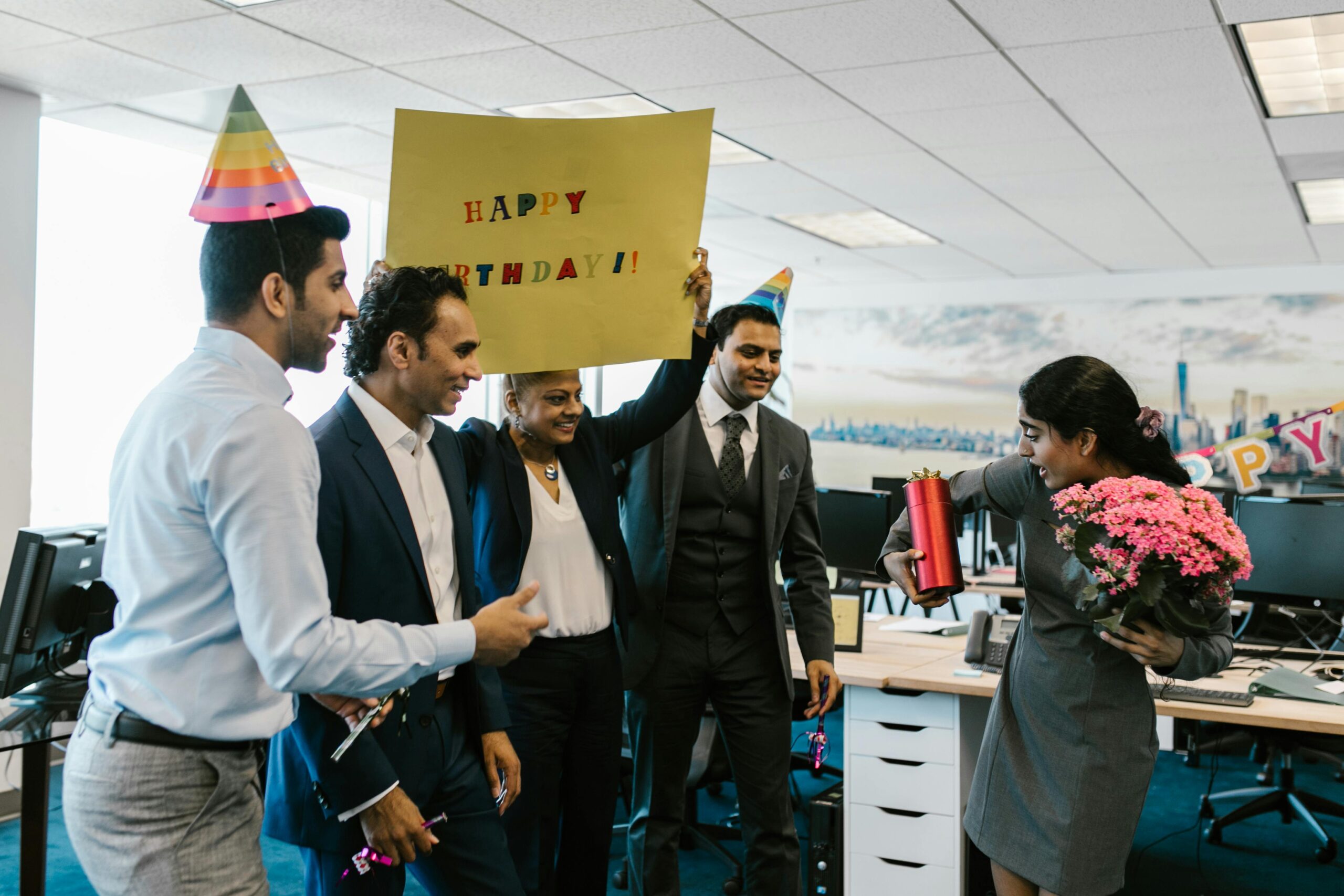 People in the office celebrating a birthday party