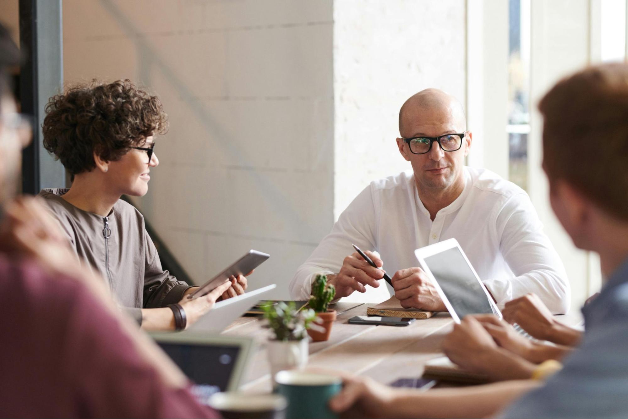 People sitting around table in office