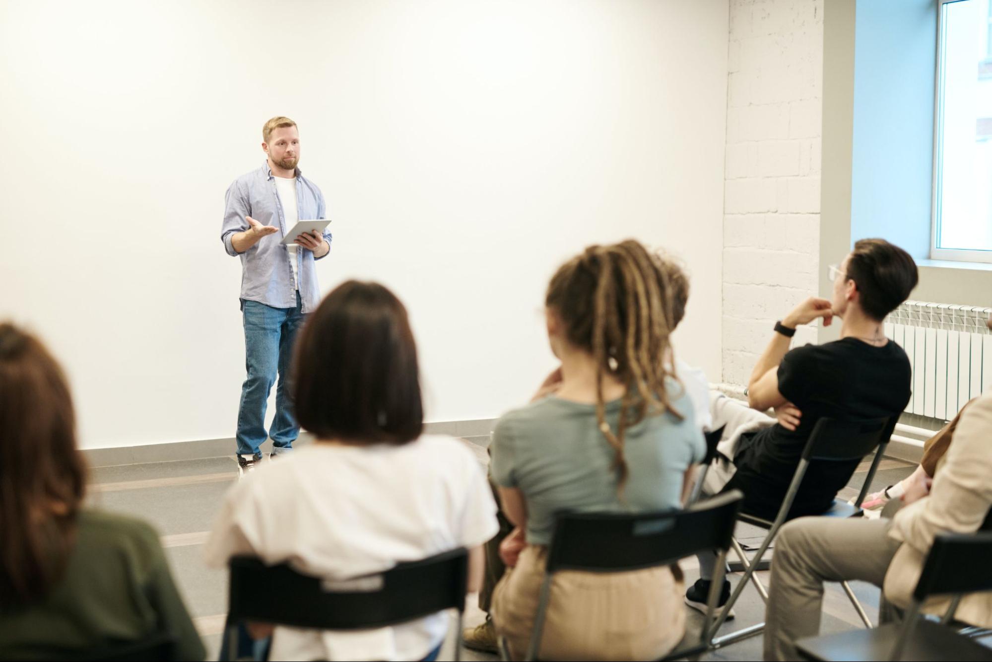 Employee presenting in front of group