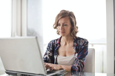 Person taking employee engagement survey on laptop