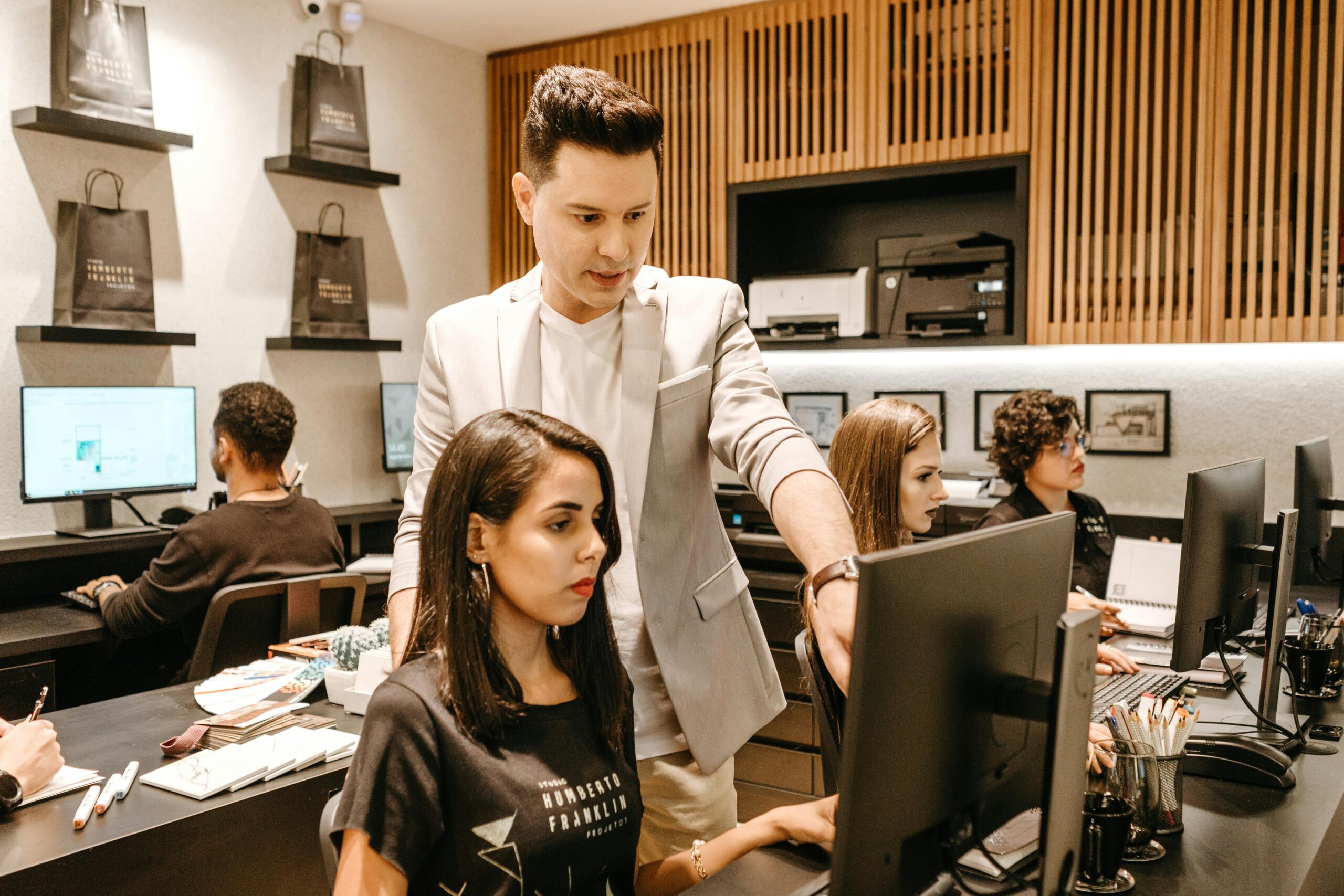 Boss working with employee at computer