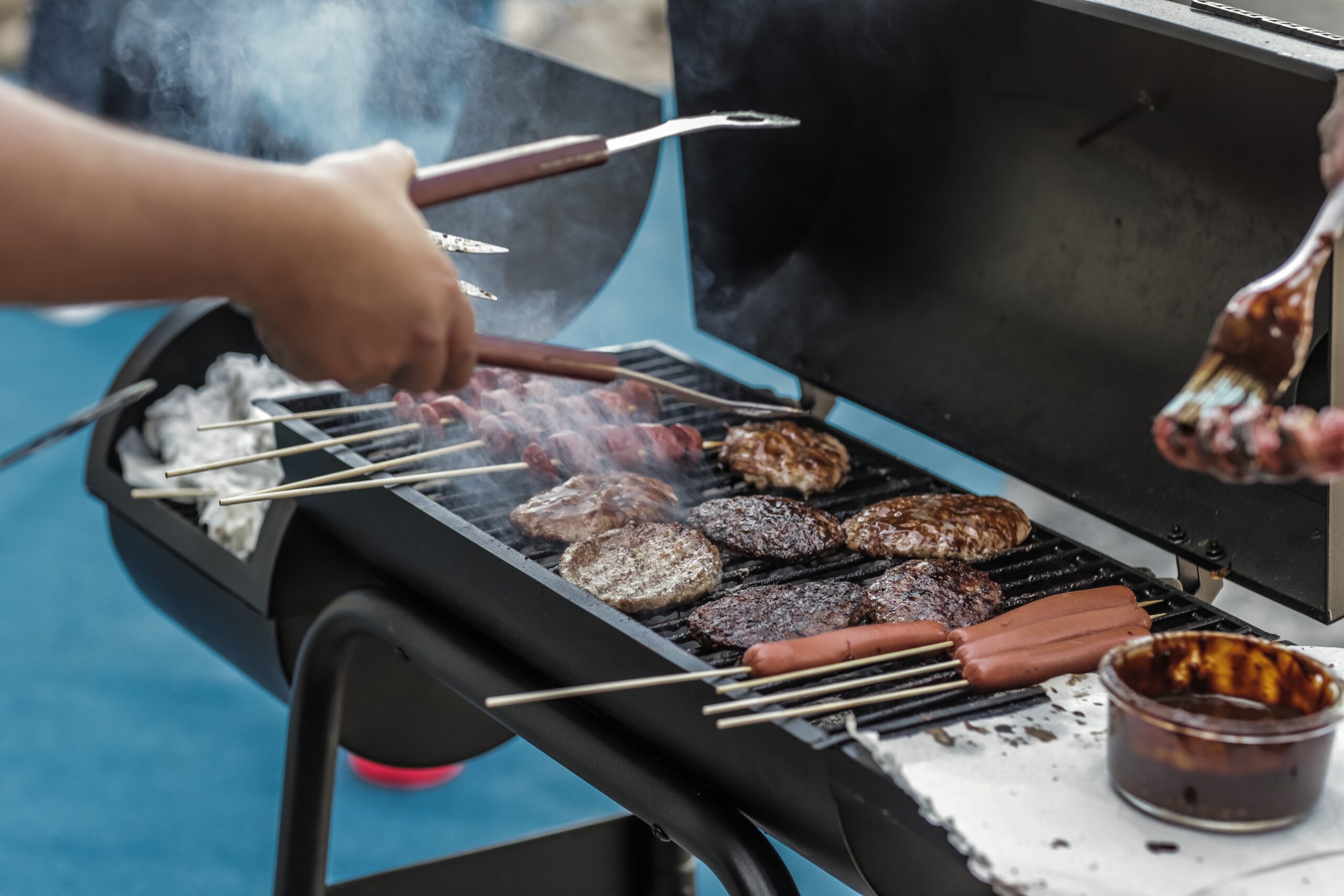 Person barbecuing at employee appreciation event