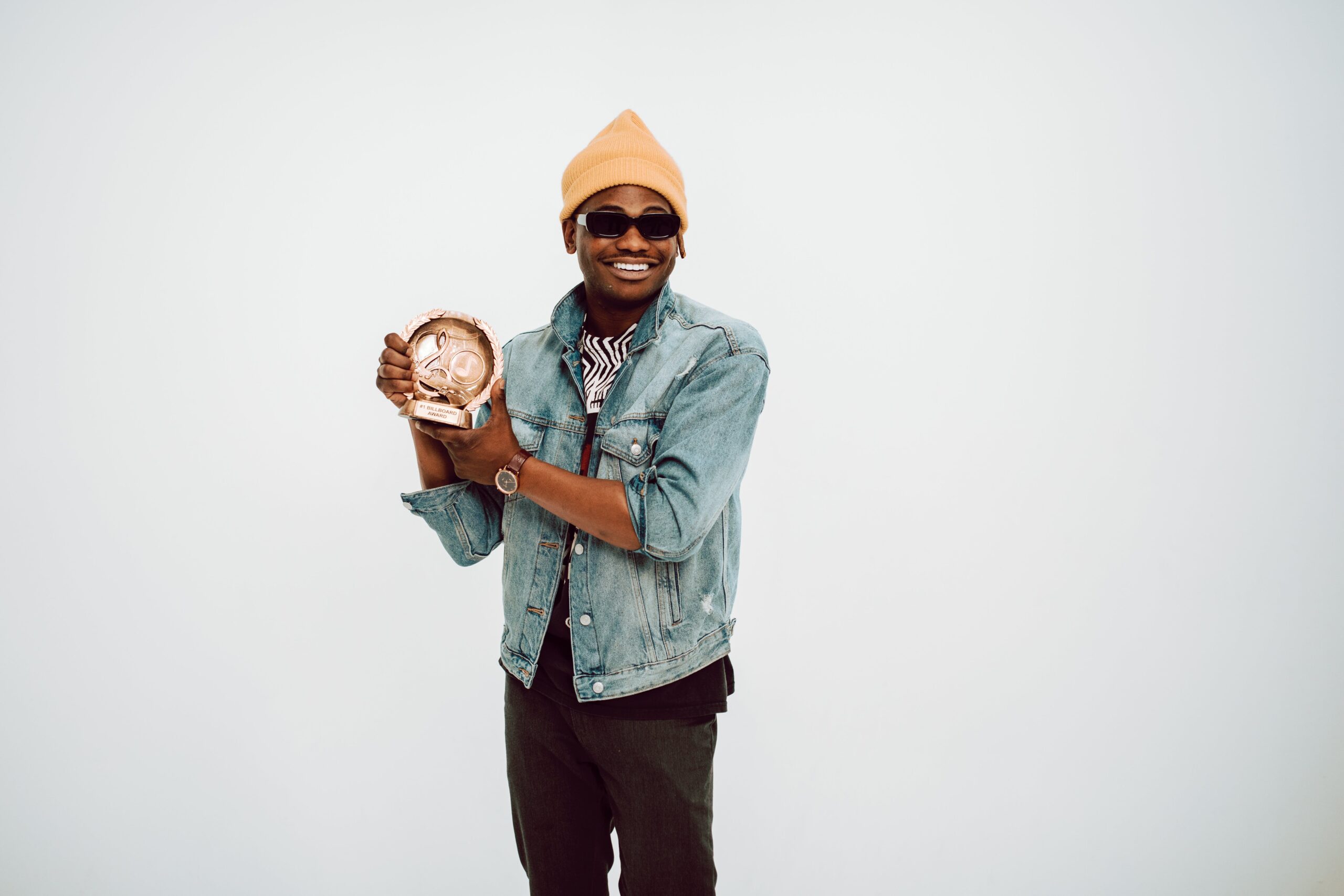 Man holding a personalized employee appreciation trophy