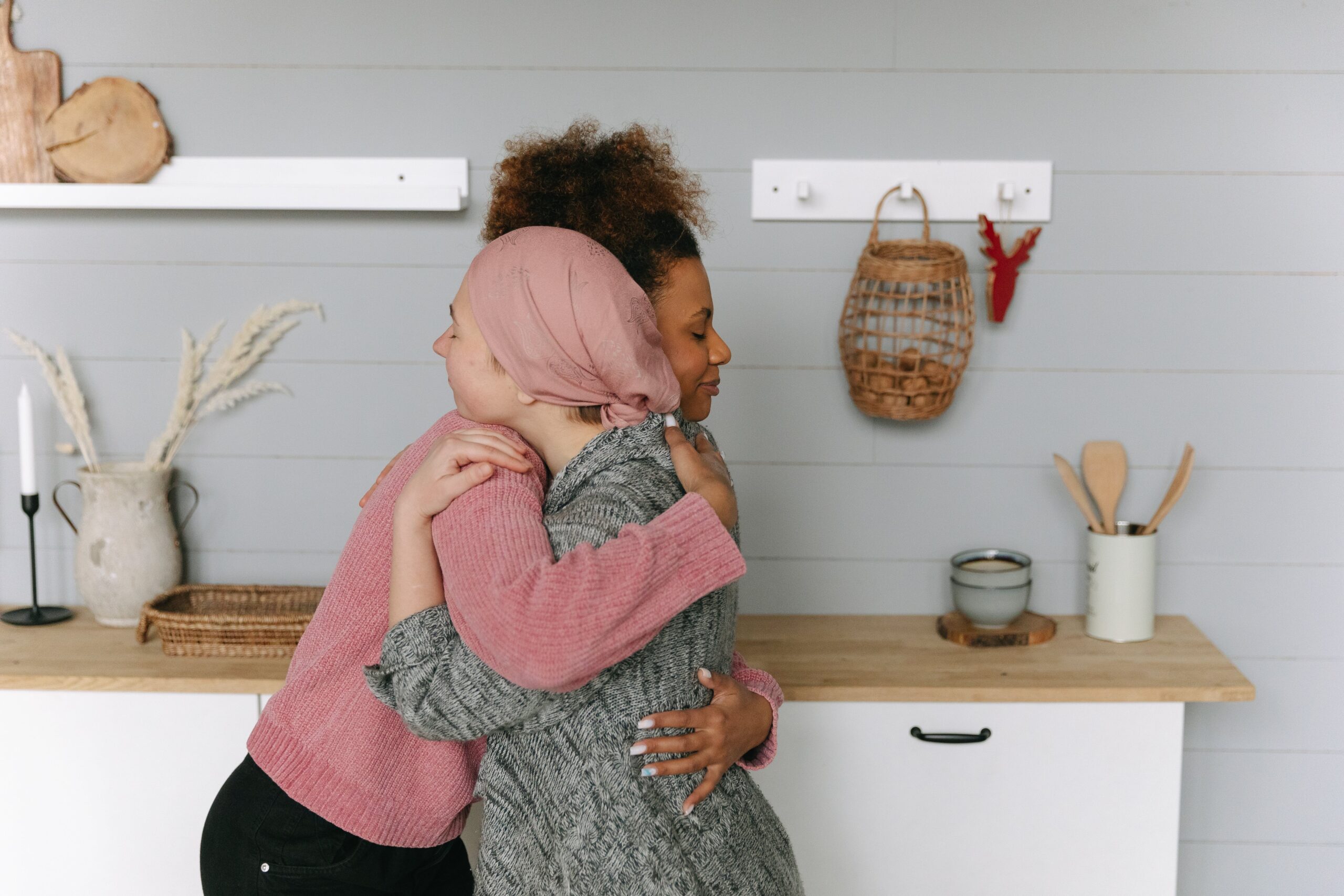 Two women hugging in condolence