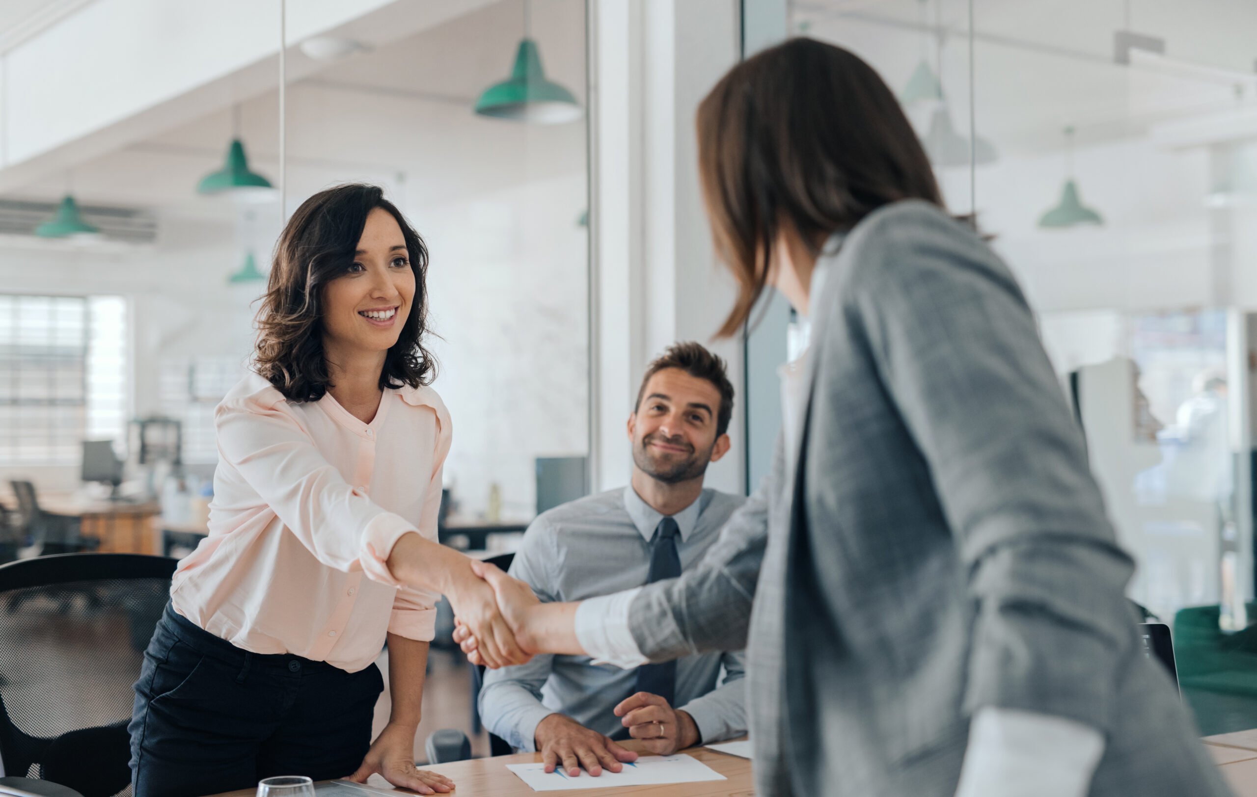 Employee shaking hands with HR on promotion