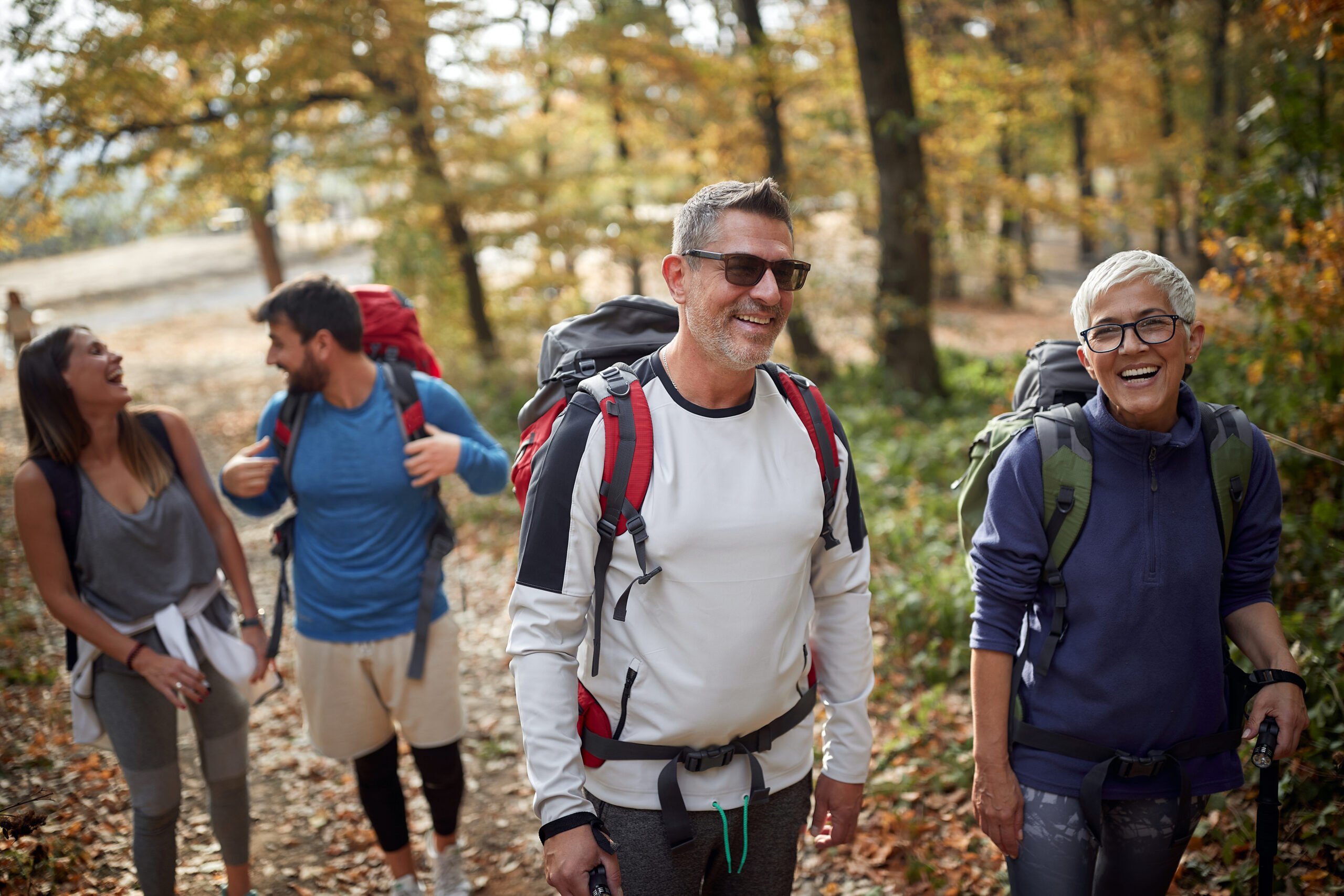 Group of employees hiking in woods