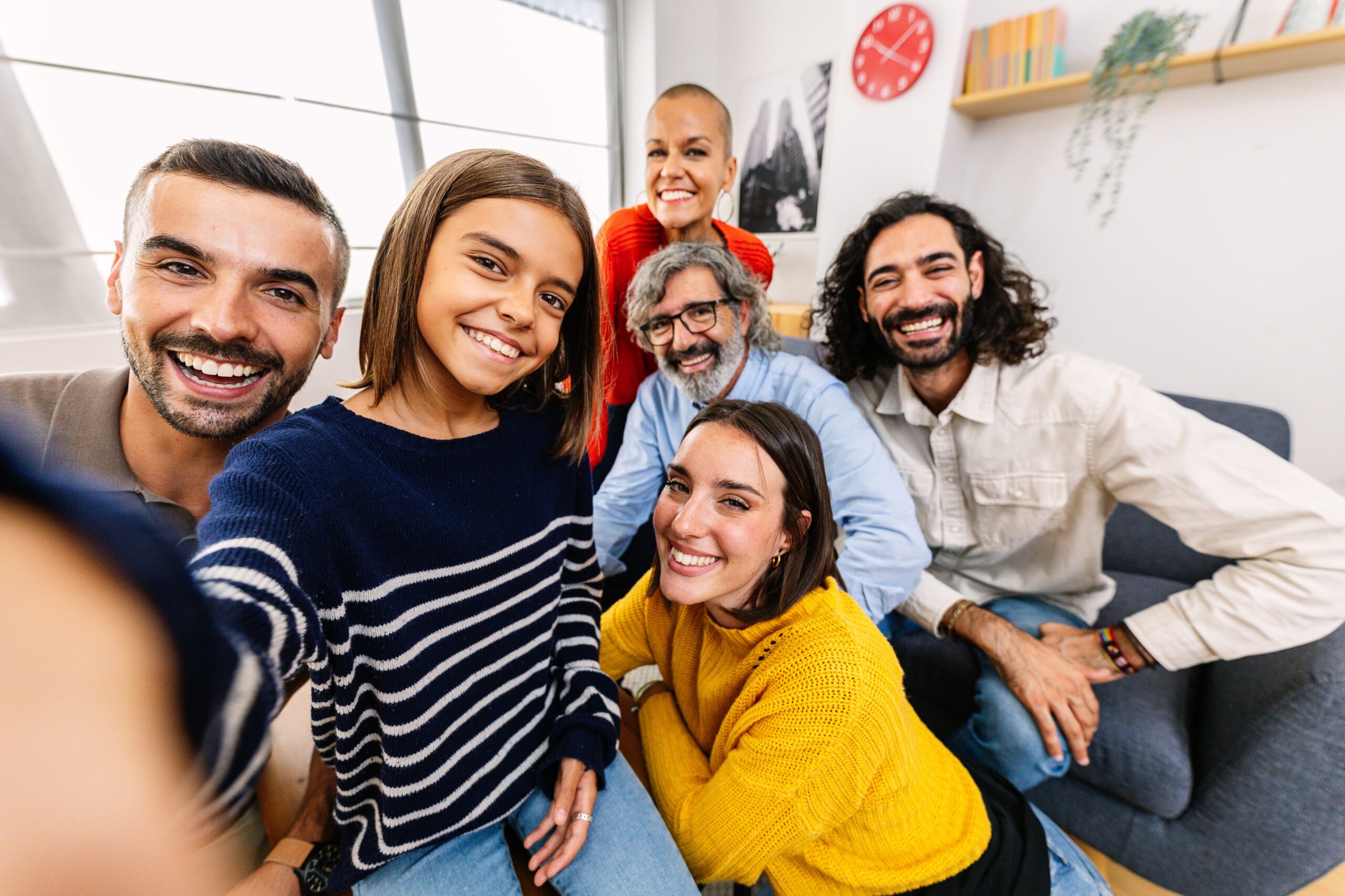 Happy self portrait of multi-generational family at home