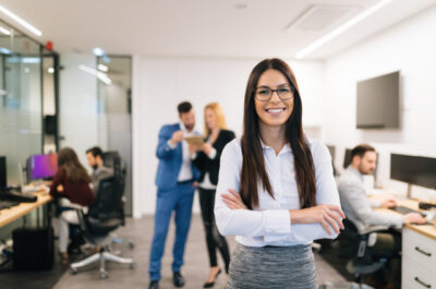 Support staff member standing in office on Administrative Professionals' Day