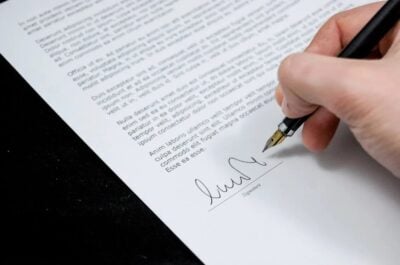 Person signing an employee recognition letter