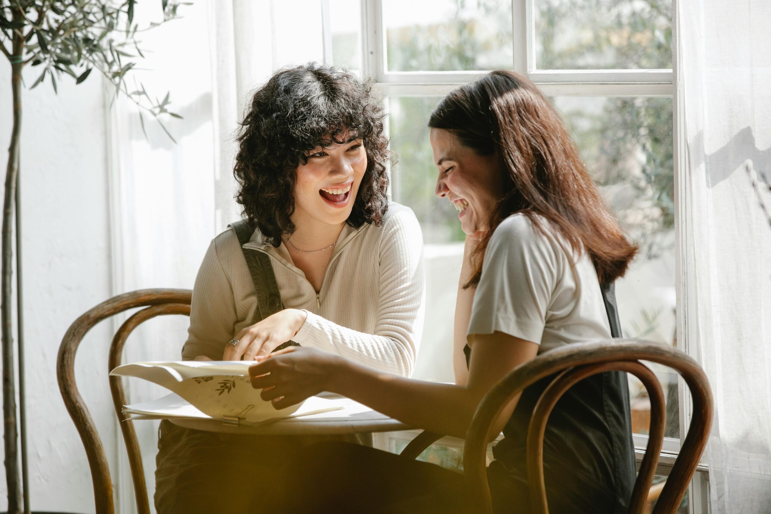 Female coworkers enjoying coffee together