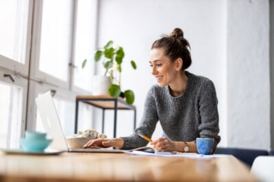 Person editing an online group card at computer