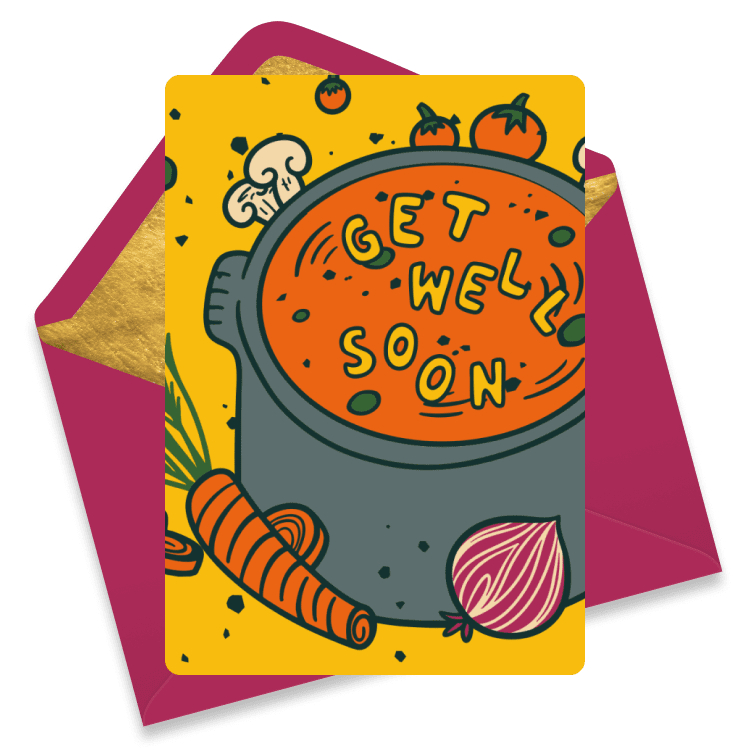 Yellow get well card depicting a big soup pot filled with tomato soup and noodles spelling a message, surrounded by vegetables like carrot, onion, mushrooms and tomatoes, paired with a magenta envelope.