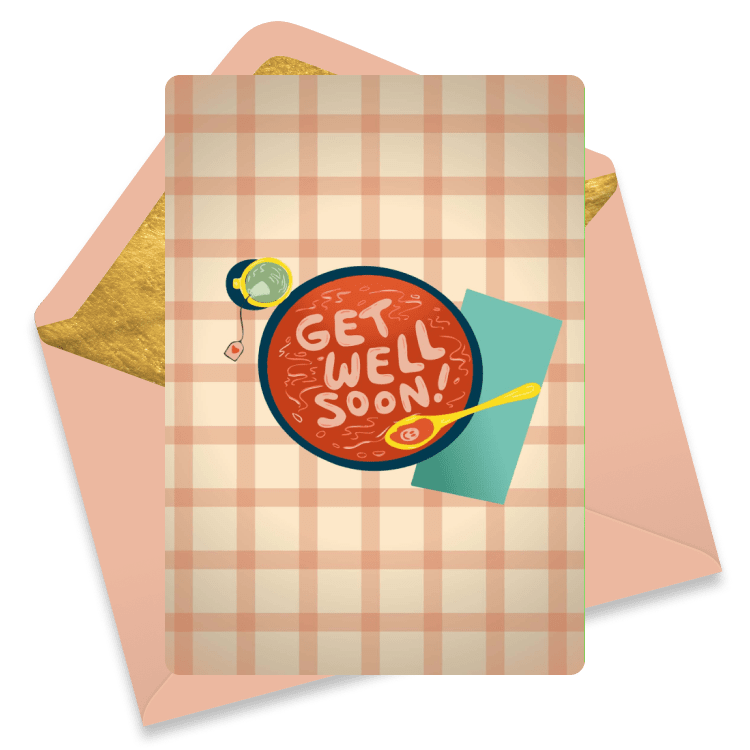A cozy get well card with an orange plaid pattern and a heart-shaped patch with cross stitches, paired with an orange envelope. 