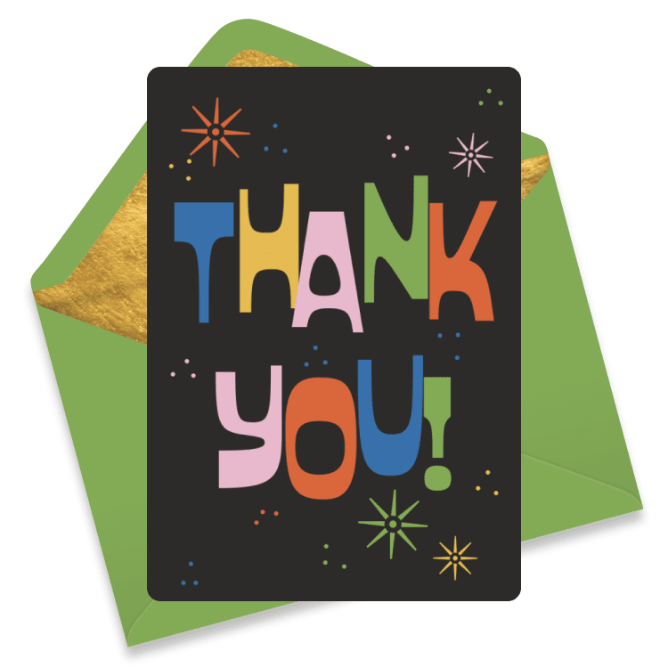 Colorful thank you card with multicolored letters on a dark background, decorated with stars, resting on a green envelope