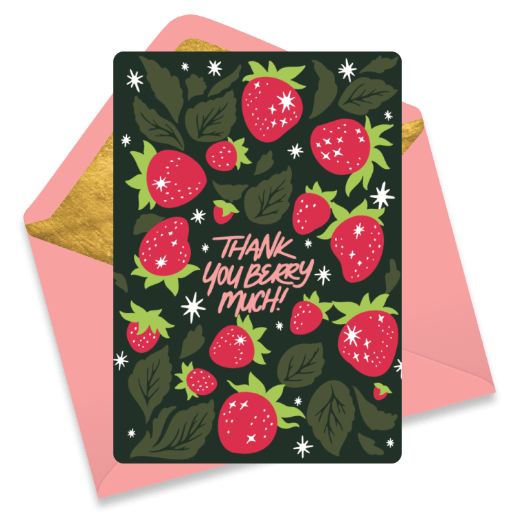 Dark green thank you card covered in bright red strawberries with green leaves and sparkles, featuring the phrase 'Thank you berry much!', resting on a golden and pink envelope.